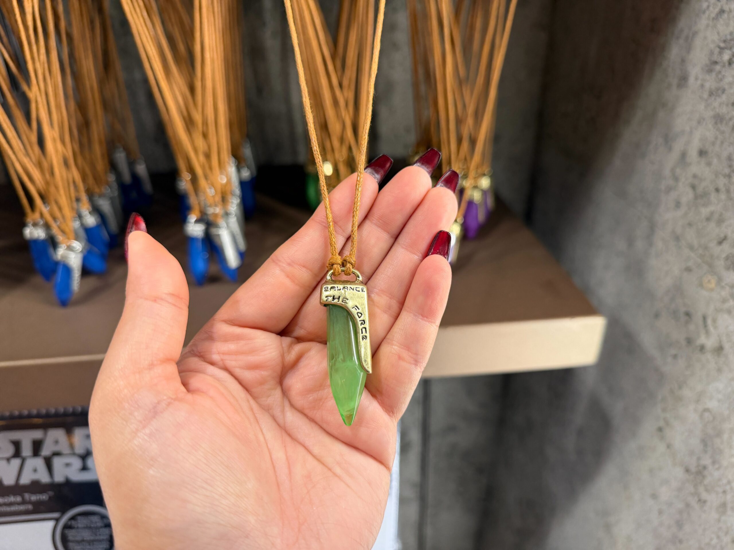 Green kyber crystal necklace in Star Wars: Galaxy's Edge at Disney's Hollywood Studios in Walt Disney World