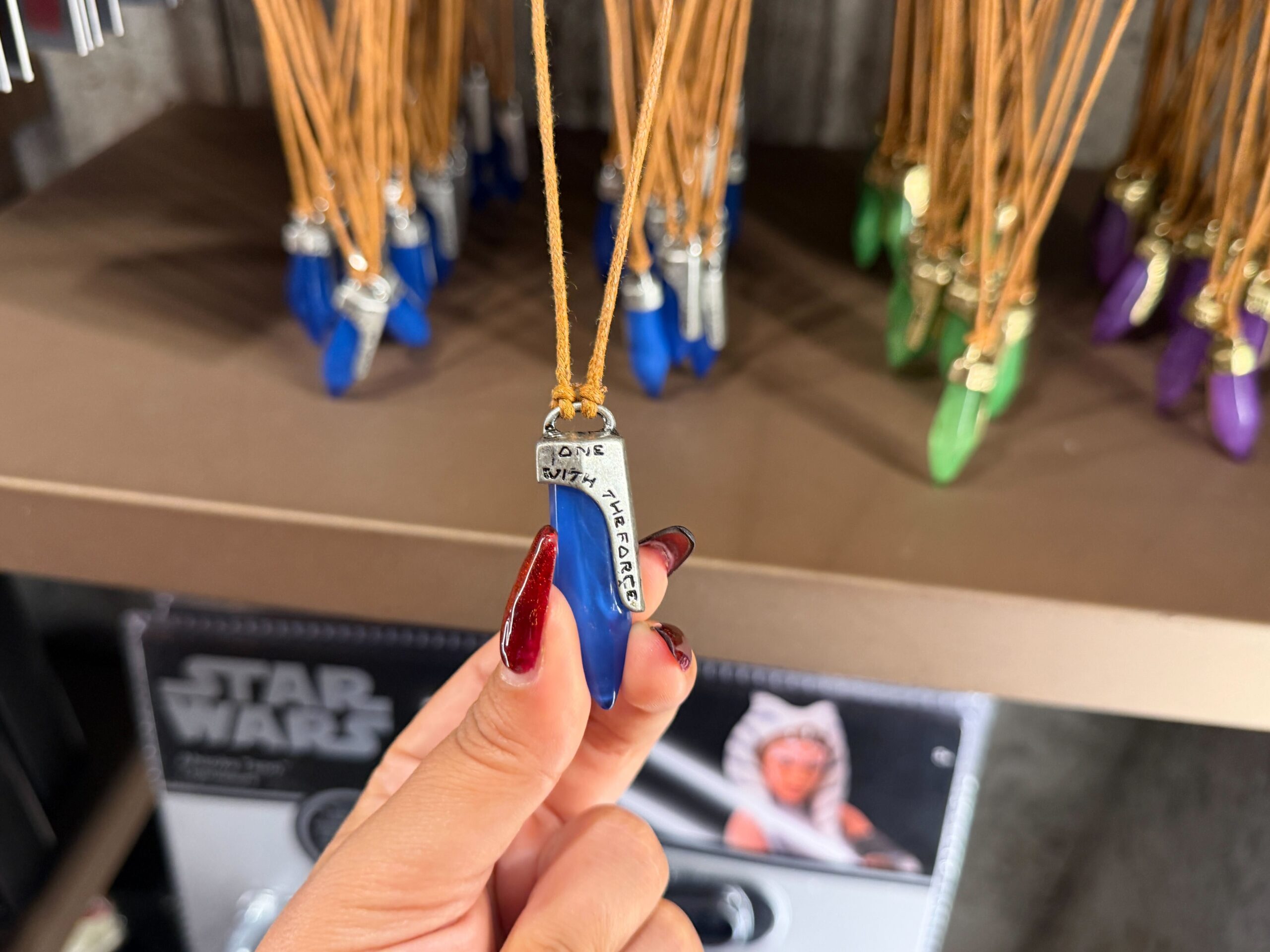 Blue kyber crystal necklace in Star Wars: Galaxy's Edge at Disney's Hollywood Studios in Walt Disney World