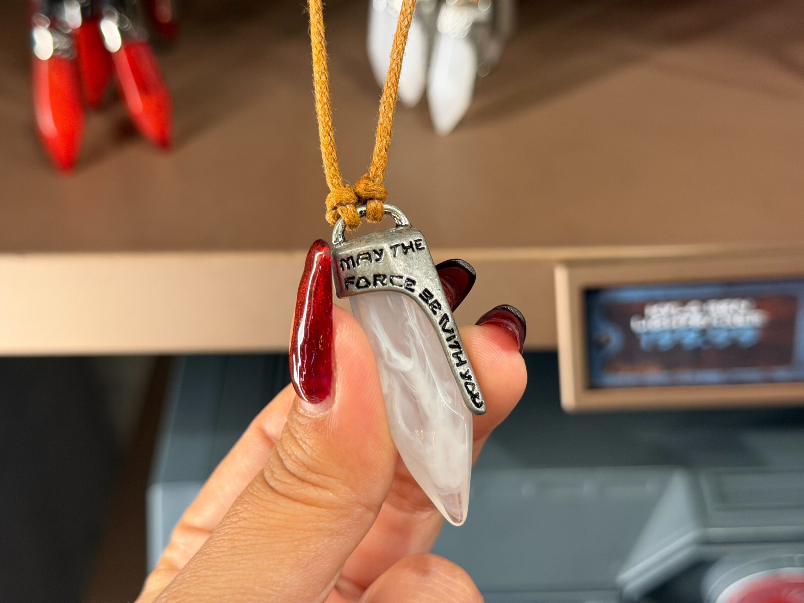White kyber crystal necklace in Star Wars: Galaxy's Edge at Disney's Hollywood Studios in Walt Disney World
