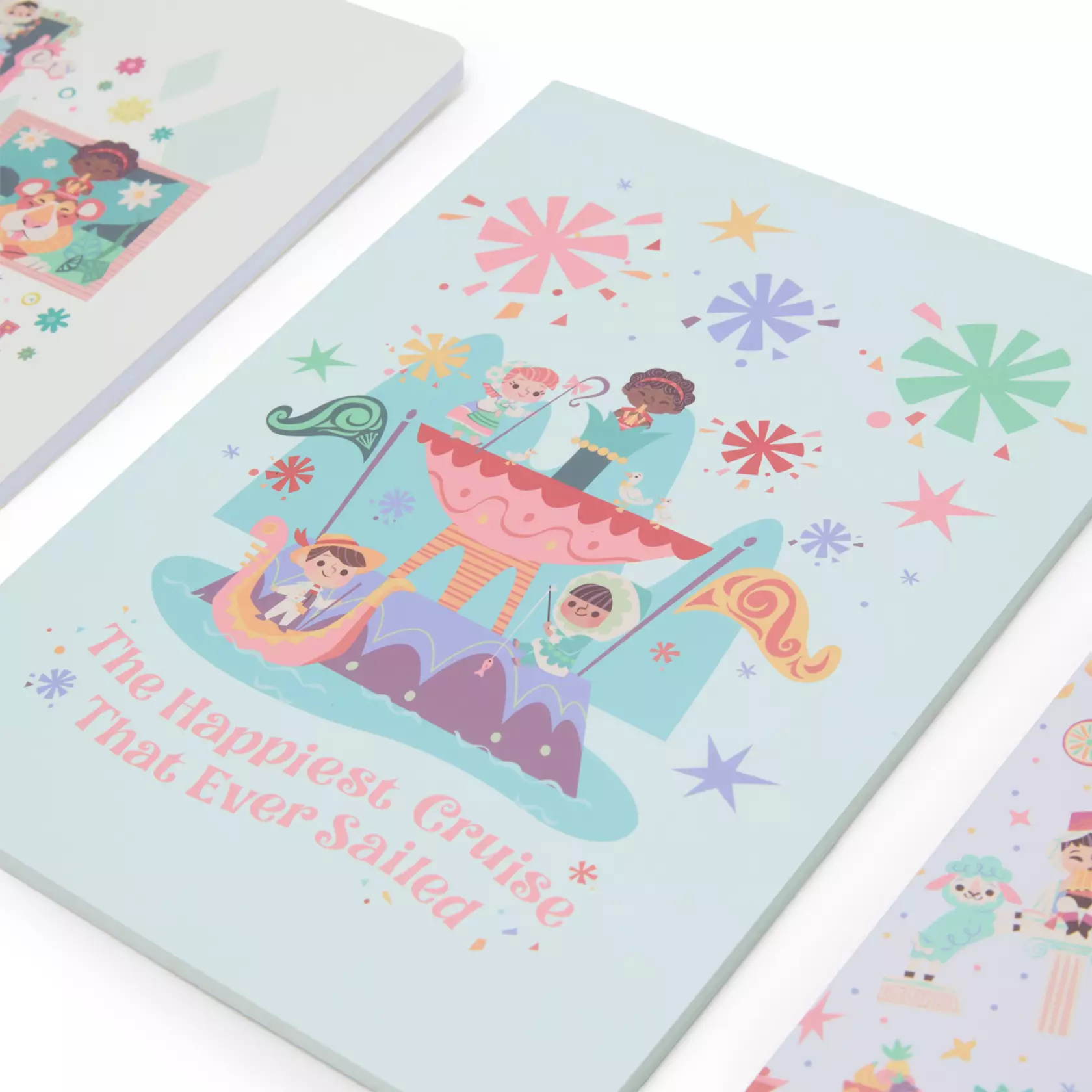 The set of three journals feature ''it's a small world'' character art on the outside and inside. There are 96 sheets of paper in each journal.