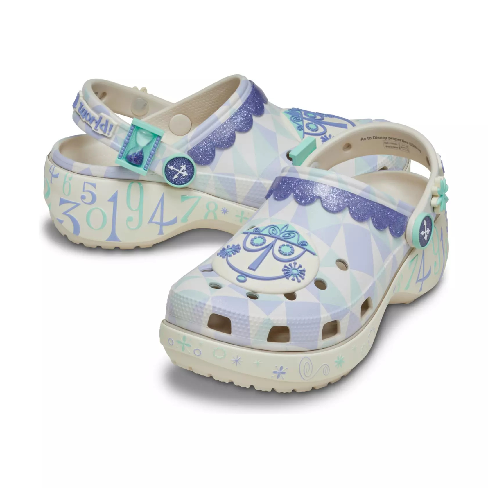 The clogs are covered in design patterns found on the attraction's facade. They are topped by clock face charms. Clock numerals are on the heels, and glittery purple faux lace trim lines the opening.