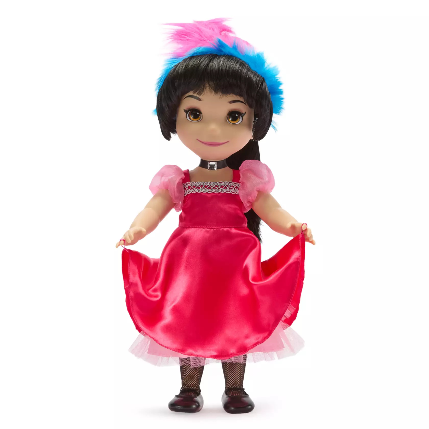 The 15" doll wears a traditional folk costume, which includes a pink satin dress and a pink and blue faux feather headpiece. Press her tummy to hear the doll sing ''it's a small world'' in both French and English. The On/Off switch is located on the doll's left side. It also comes in collector's display box.