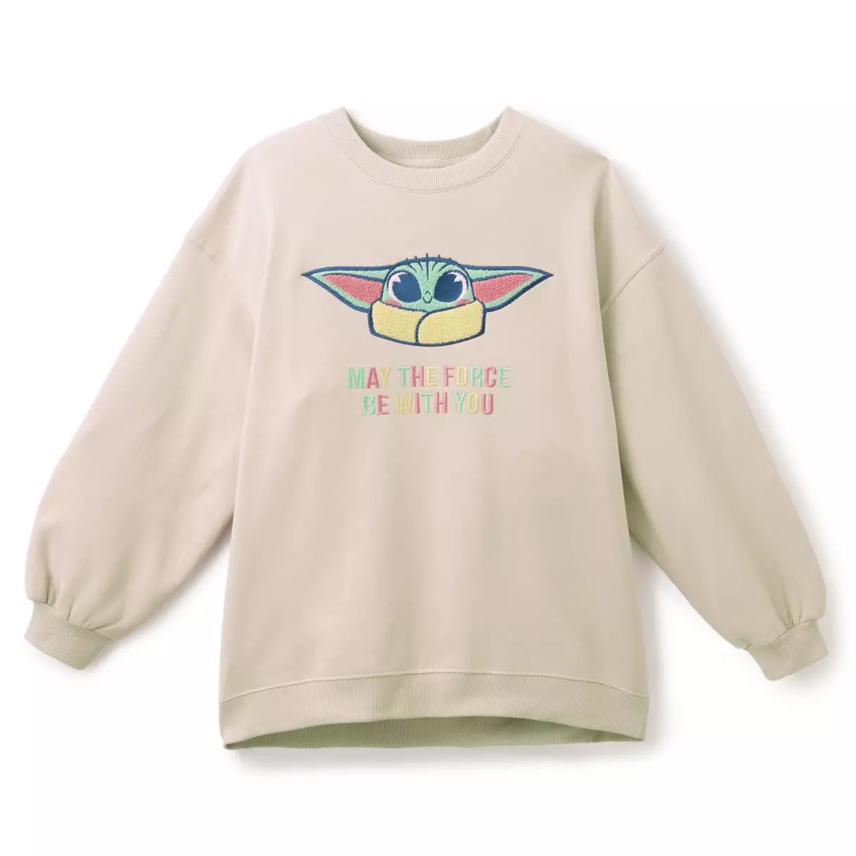 This beige sweatshirt has a chenille appliqué of Grogu's face on the chest above "May the Force be with you" in colorful embroidery. It has dropped shoulders, raised seams, a high-low hem, a center seam on the back, a round neck, and ribbed trim. The interior is fleece fabrication.