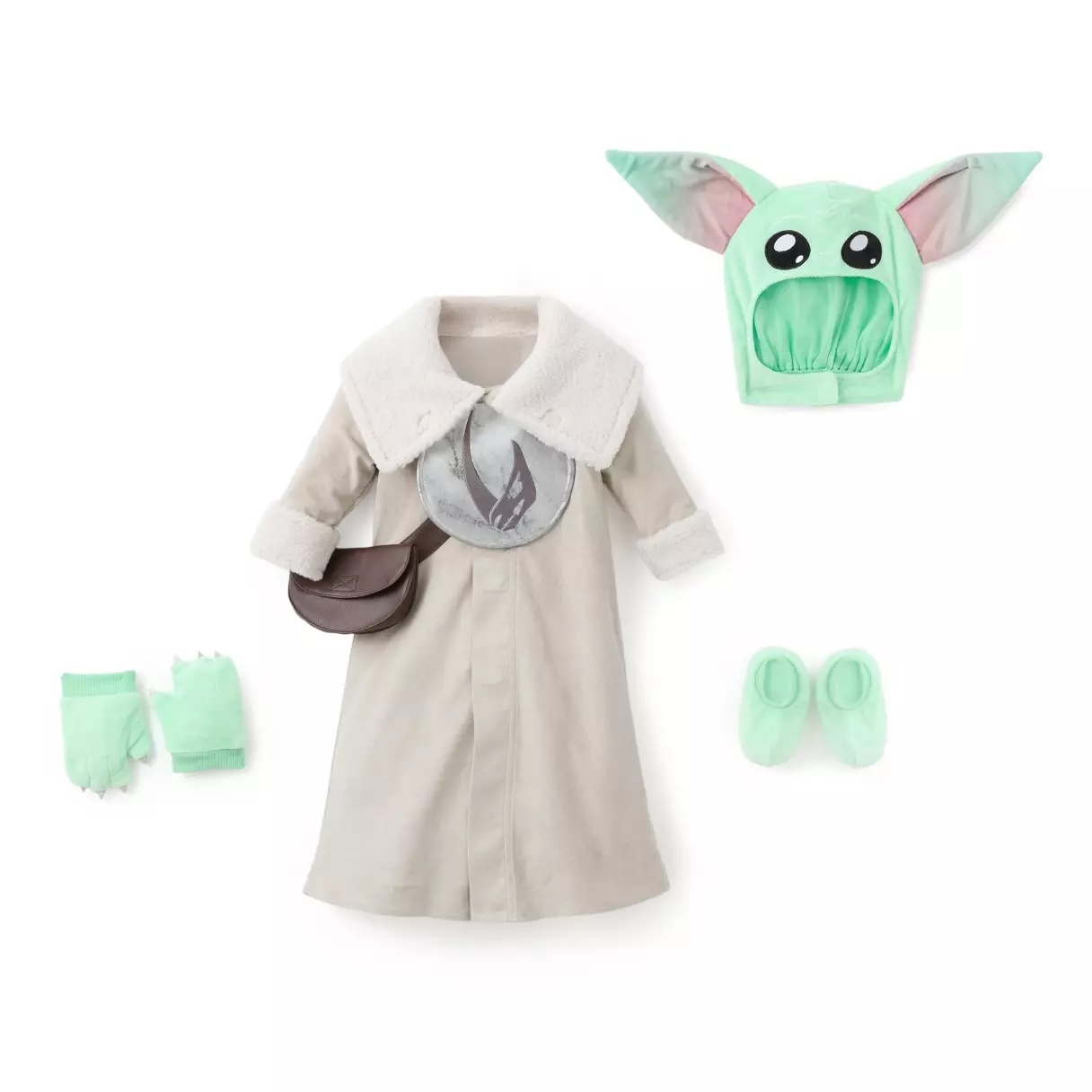 Little ones can become Grogu with this seven-piece set. It includes the beige robe, Grogu head hood, pouch, two mitts, and two booties. The hood has embroidered features and plush ears. The robe is made of soft faux suede with faux sherling trim. An embroidered mudhorn emblem is on the chest plate. Inside the pouch is a frog squeaker toy. The costume has Velcro closures and is mostly polyester with polyurethane.