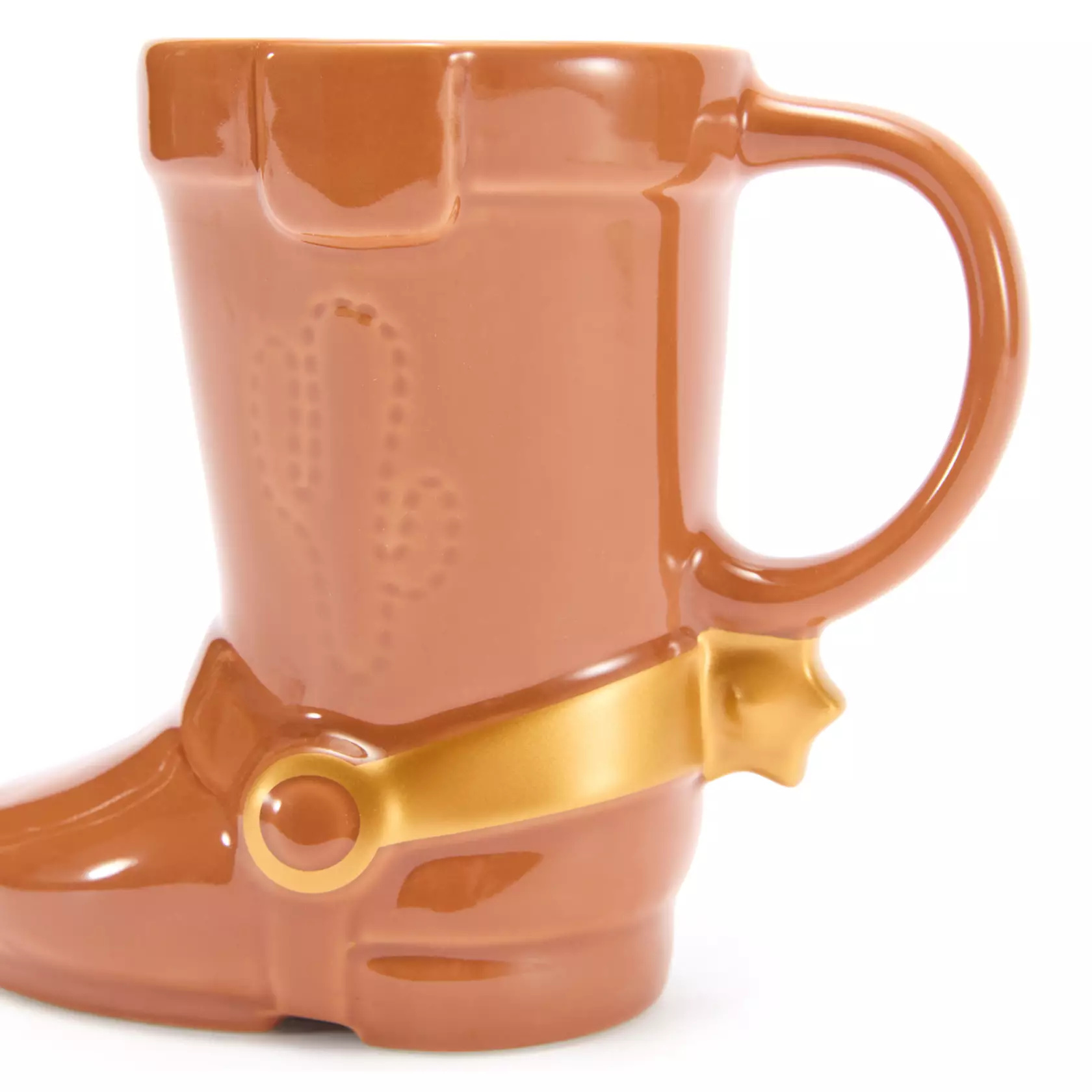 Woody's sculpted ceramic mug is in the form of his iconic boot with golden spurs and ''stitched'' cactus insignia. The gloss glaze mug holds 14 ounces of hot beverages. It is dishwasher safe but not microwave safe.