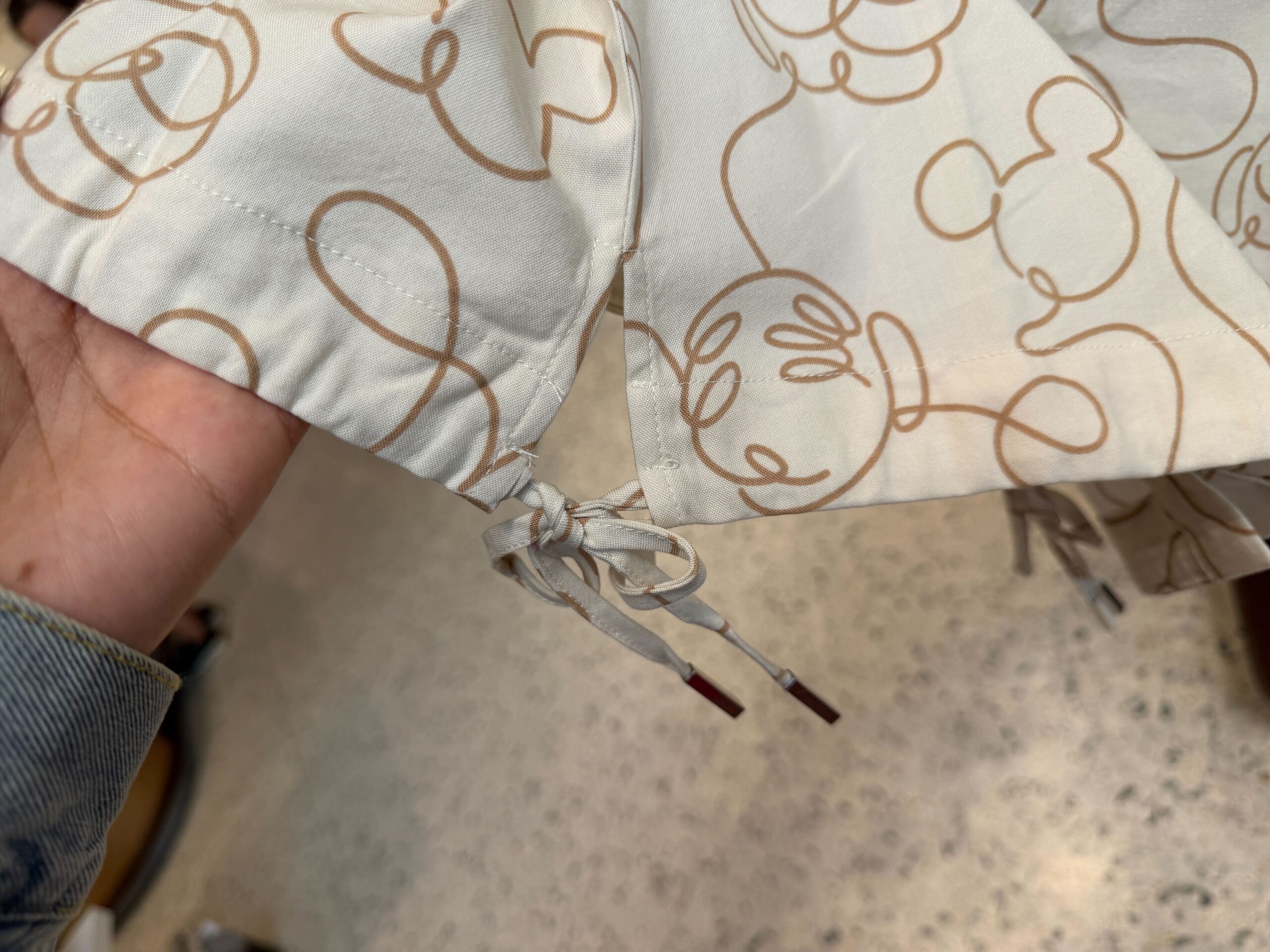 Bottom ties of Mickey Outline Collared Shirt.