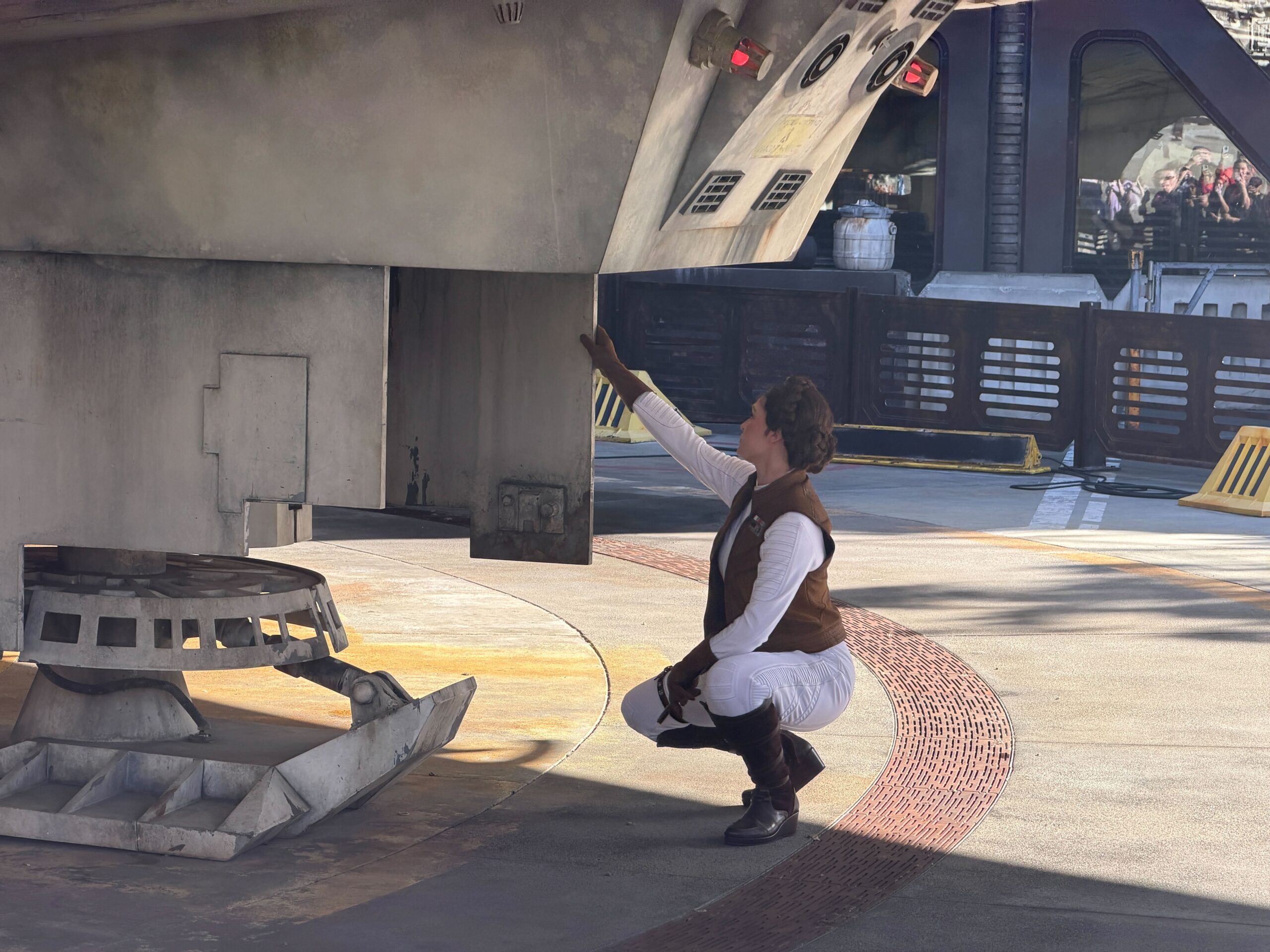 Leia Organa fixes the Millennium Falcon at Disneyland
