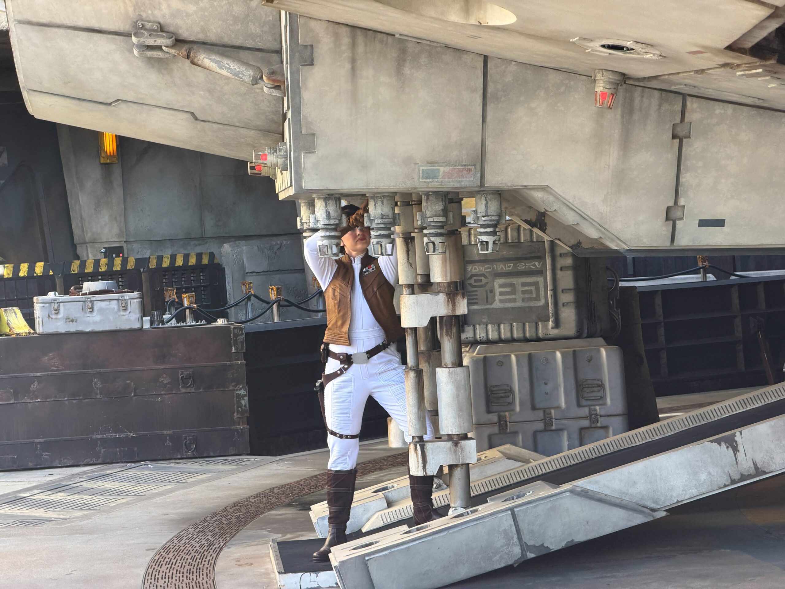 Leia Organa fixes the Millennium Falcon at Disneyland