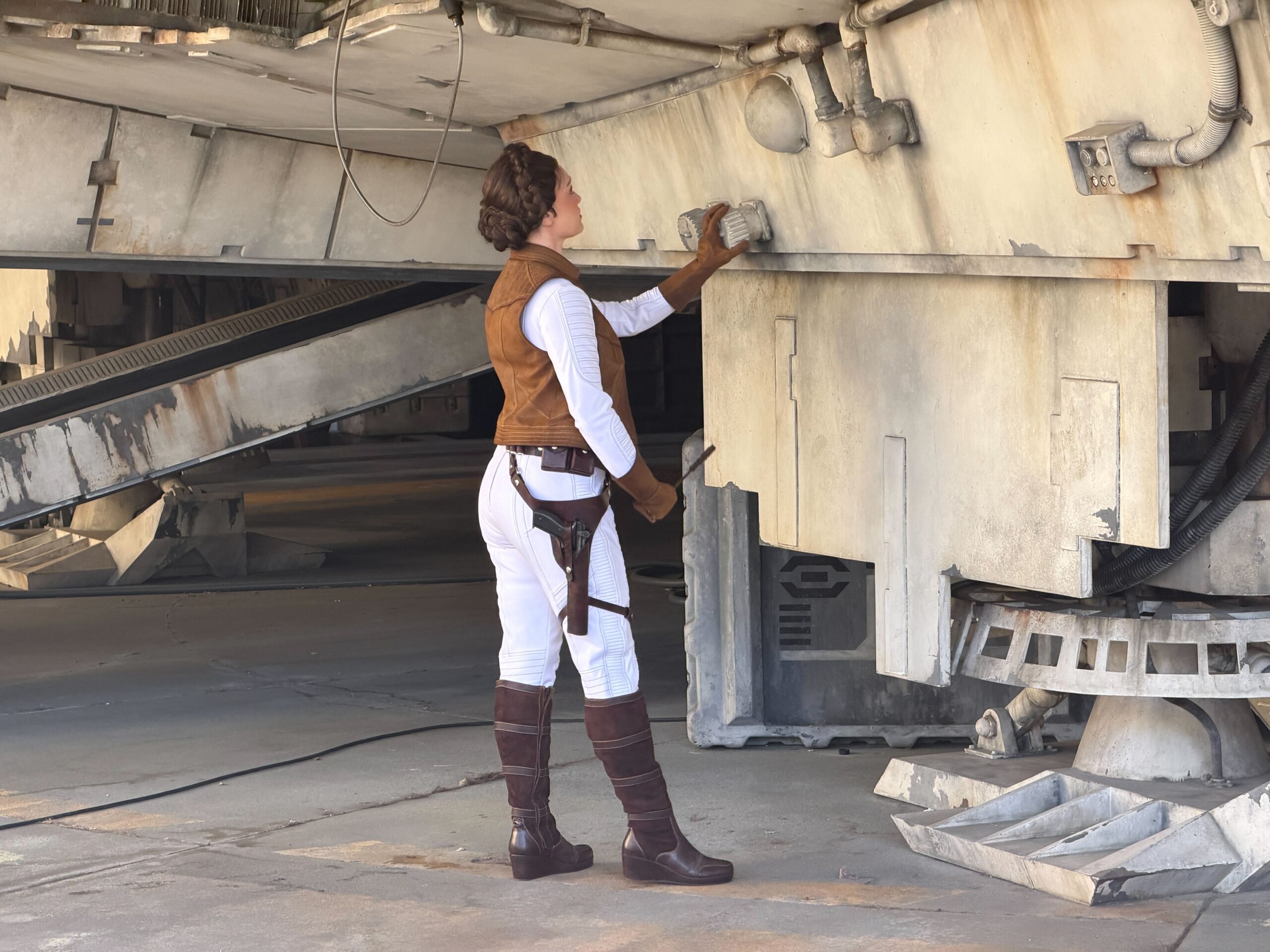 Leia Organa fixes the Millennium Falcon at Disneyland