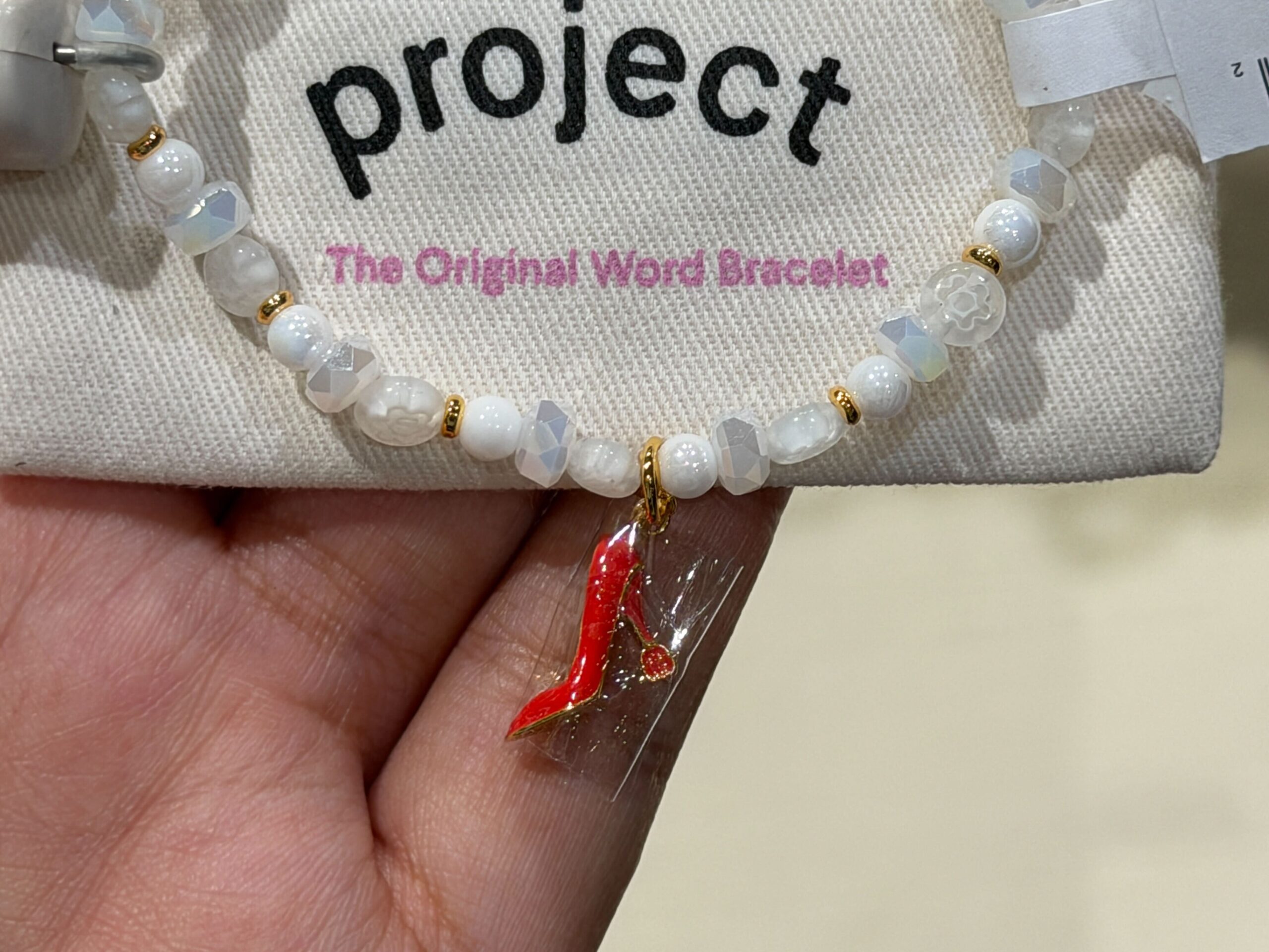 Close-up of Red Heel Charm Bracelet.