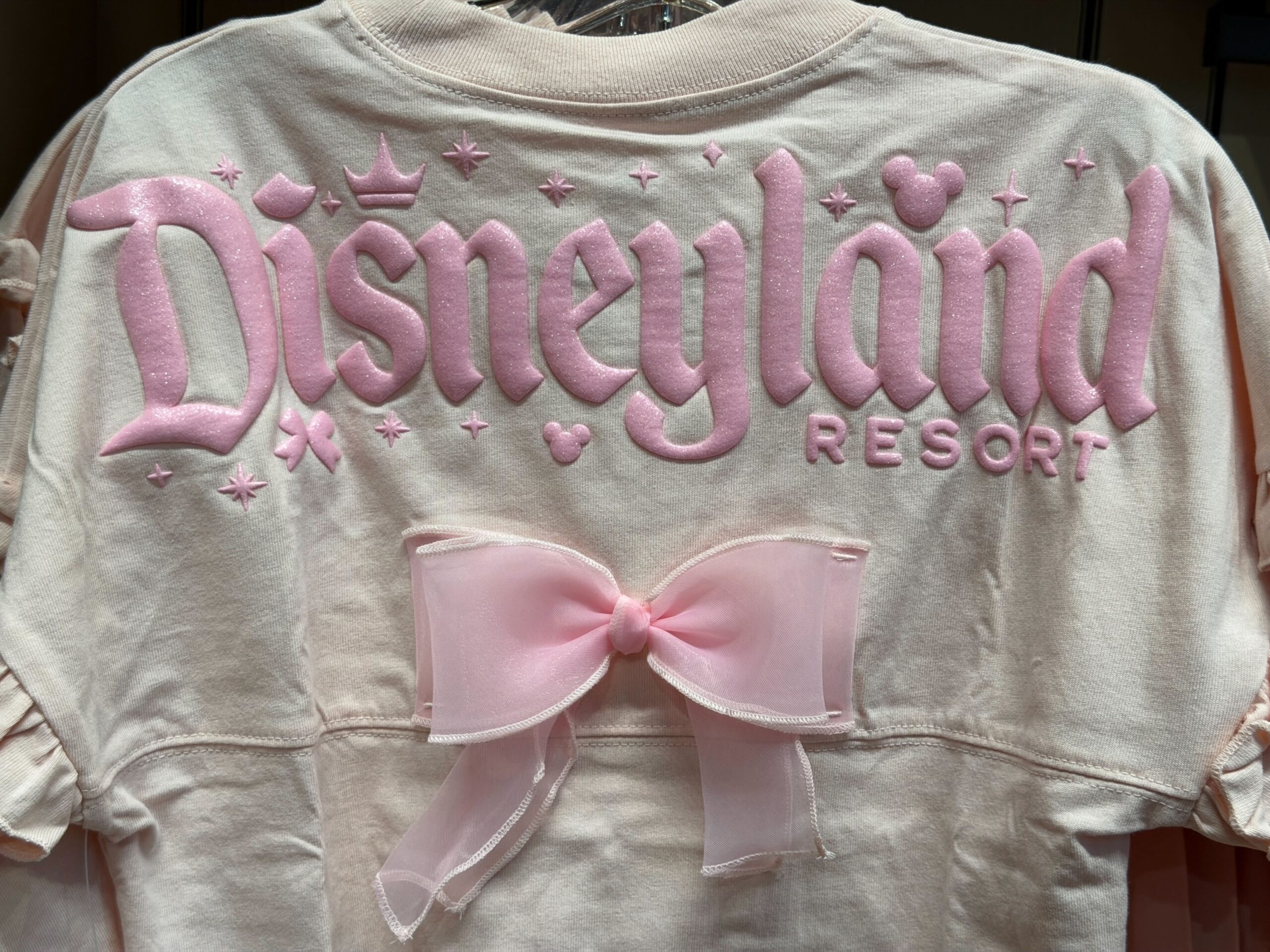Underneath is a large pink tulle bow in the center.