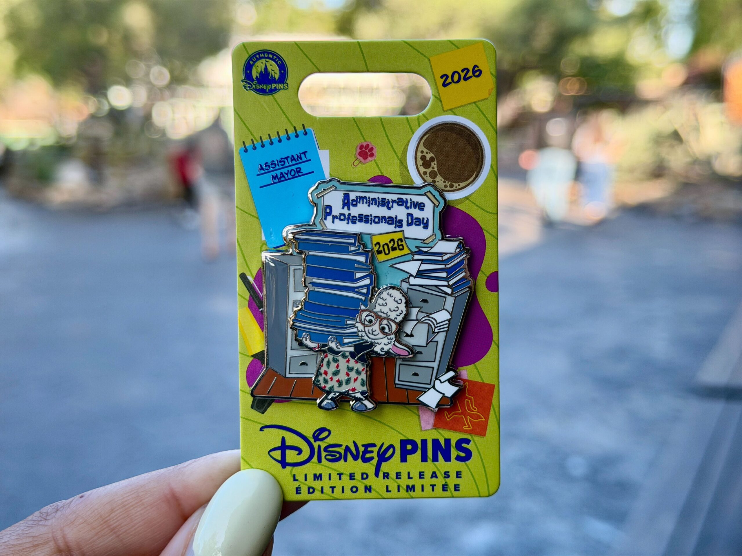 Administrative Professionals Day falls on Wednesday, April 22 this year. The 2026 pin features Assistant Mayor Dawn Bellwether from Zootopia with a pile of paperwork at her desk.
