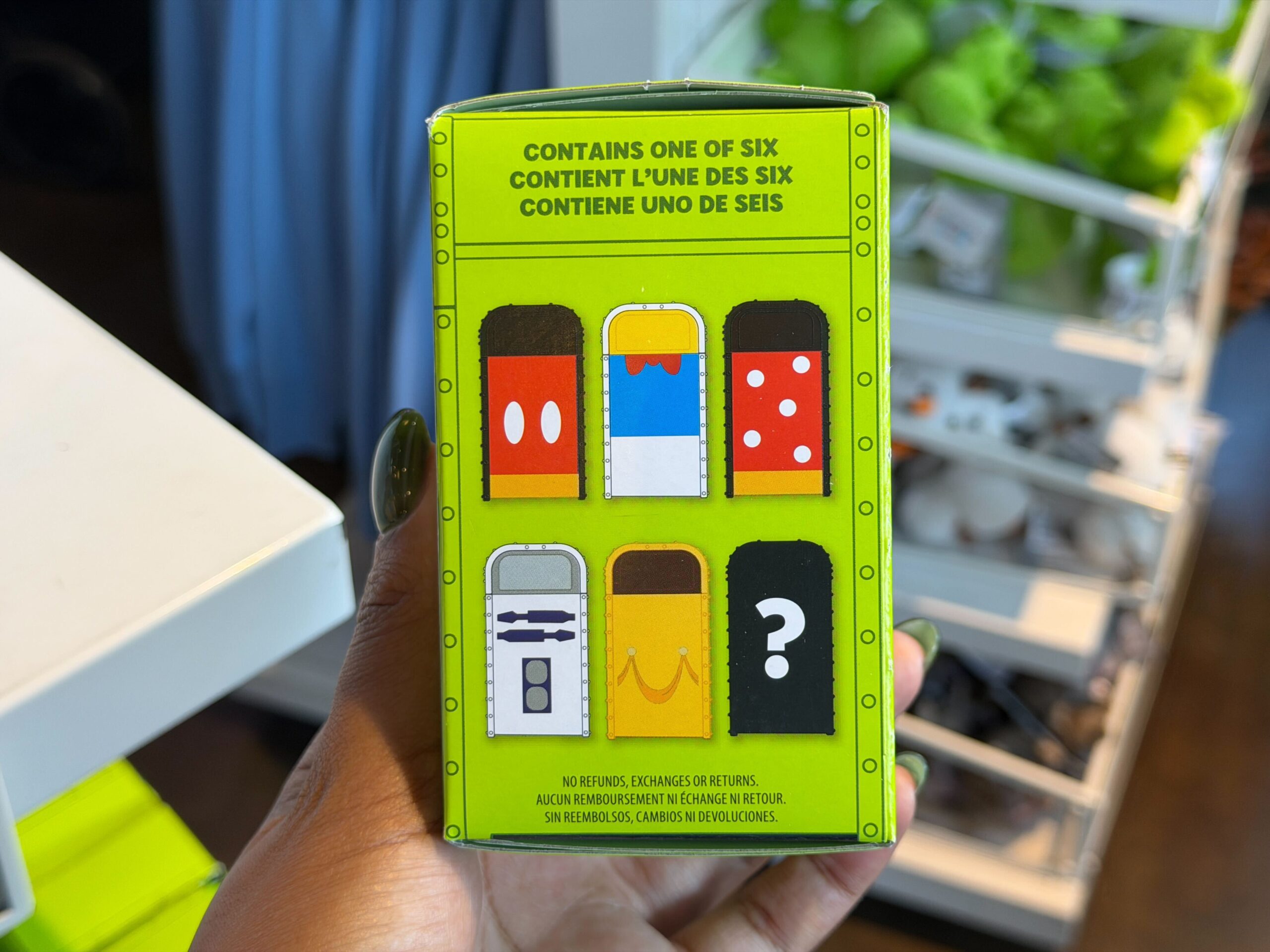 The mystery trash can figures feature designs inspired by various Disney characters, including Mickey, Minnie, Donald, Belle, and R2-D2.
