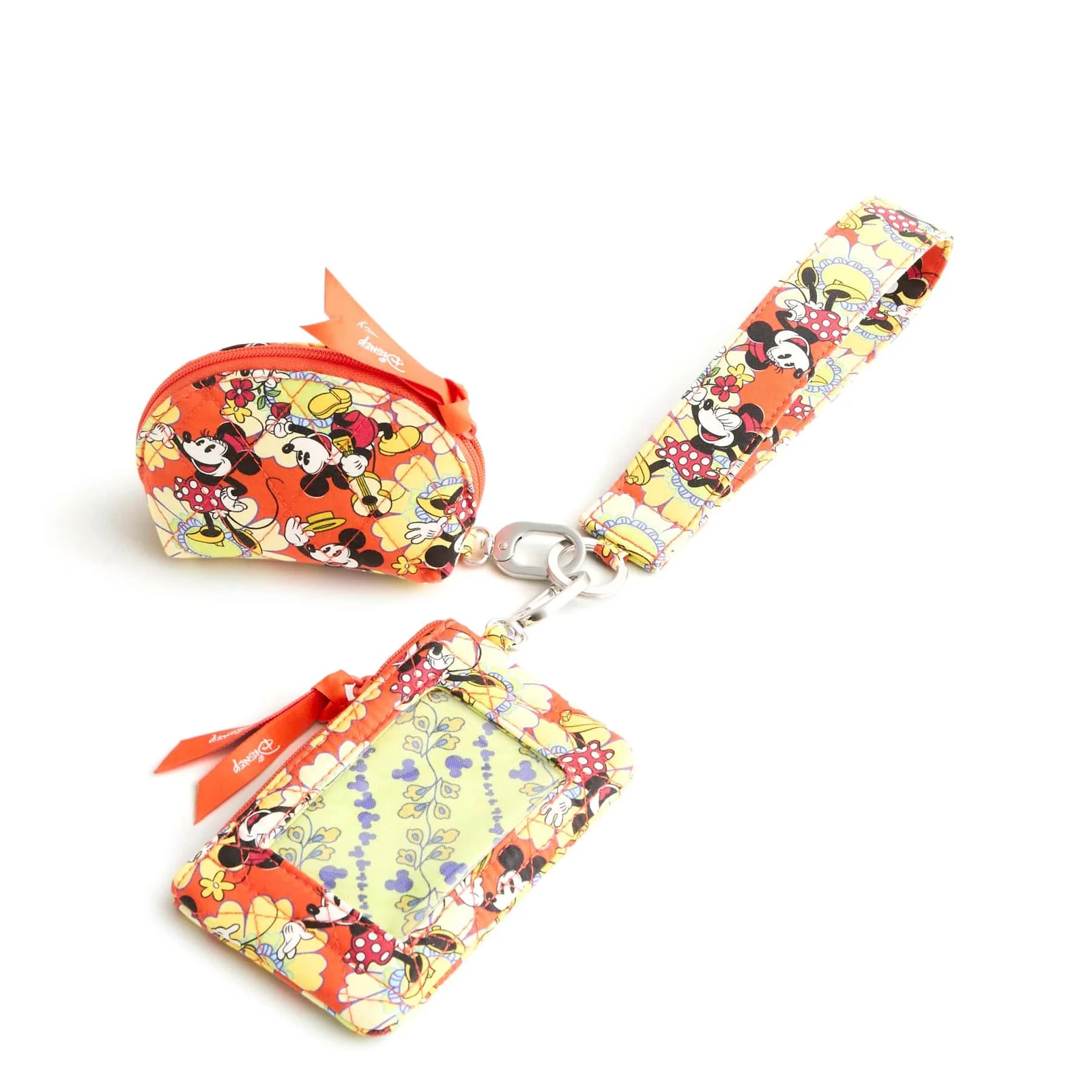 Featuring the predominantly orange pattern of Minnie and Mickey in their classic outfits, romping around yellow flowers. This has a wristlet, coin pouch, and ID case.
