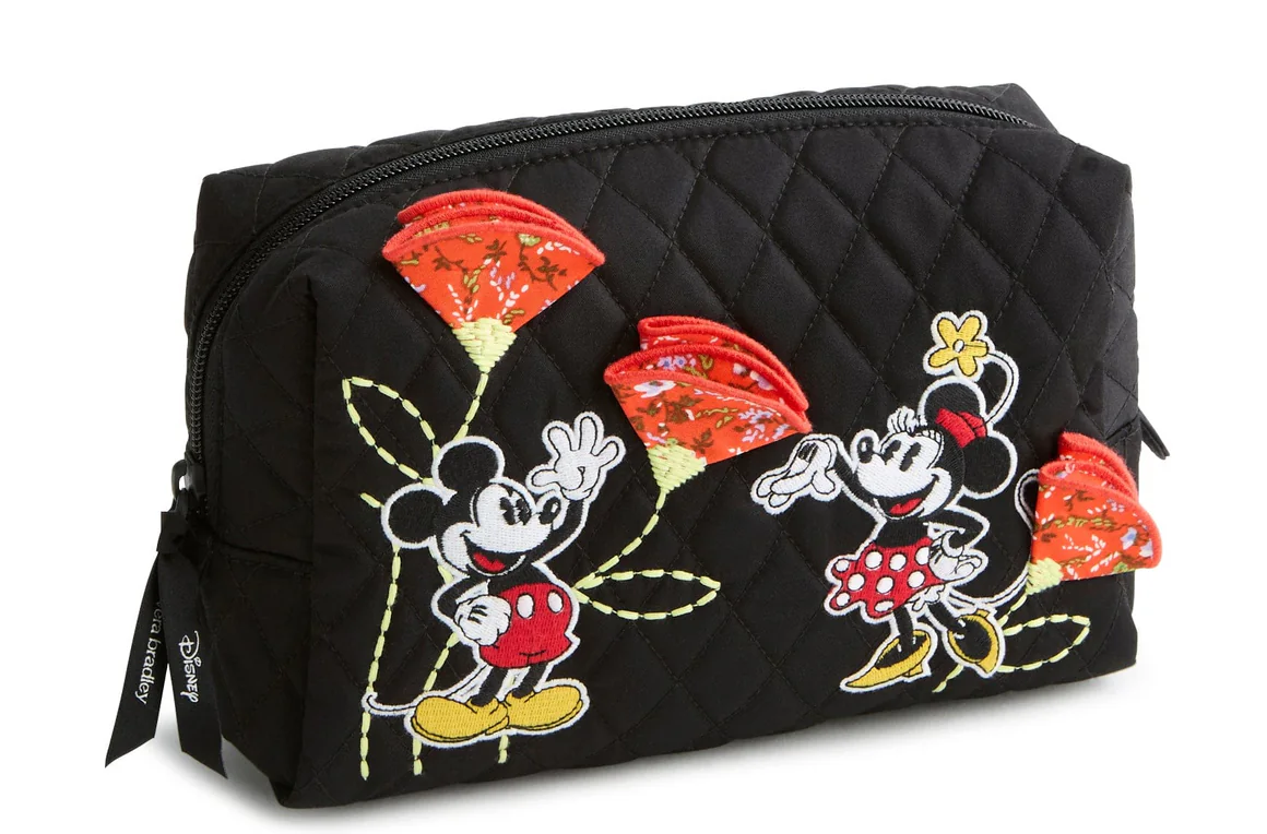 This medium cosmetic bag is in the same style as the ID case above. But Minnie is also shown on it, and there is an extra flower.