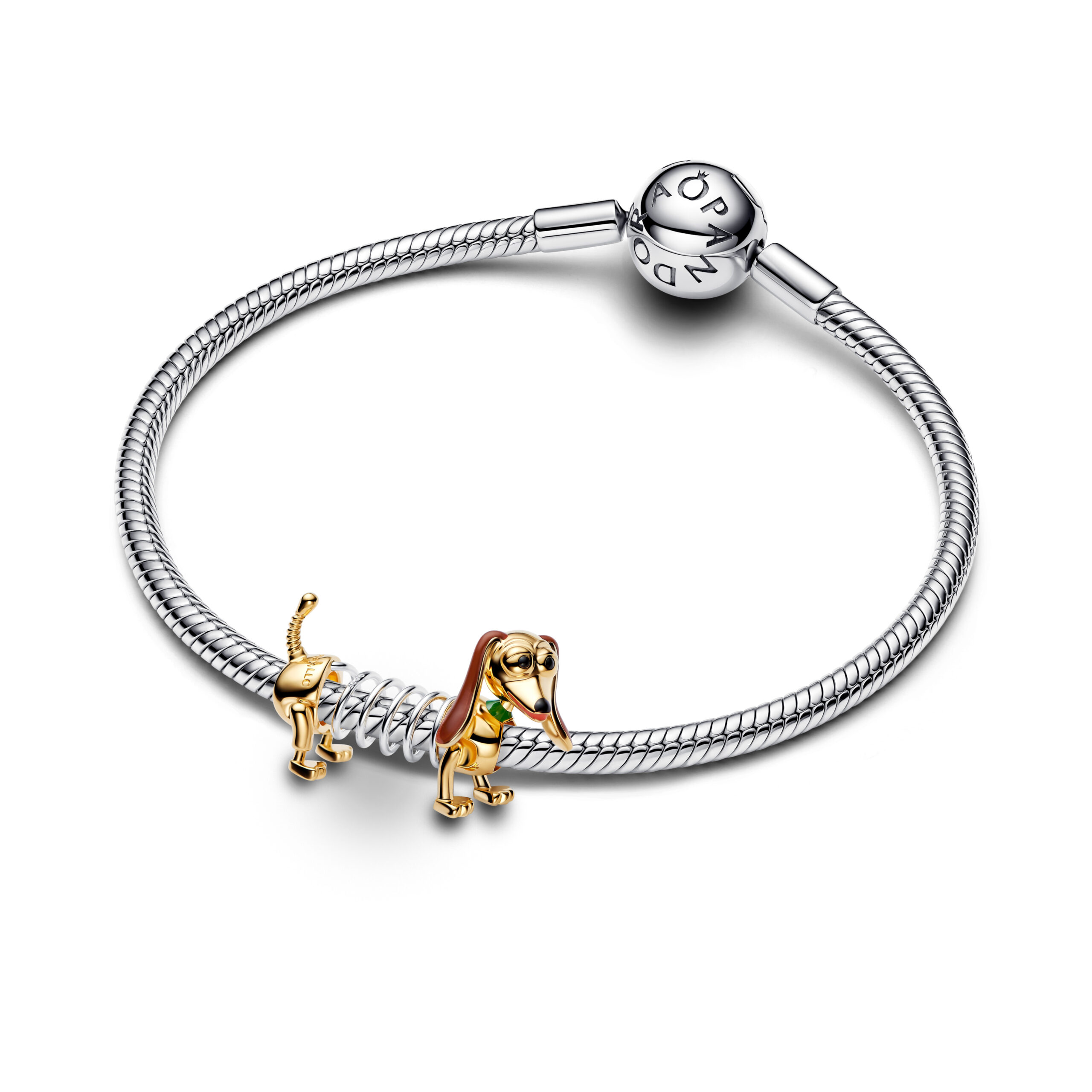 Lastly, charm your stack from back to front with Slinky. It has a springy sterling silver middle, 14k gold plating, and enamel coloring.