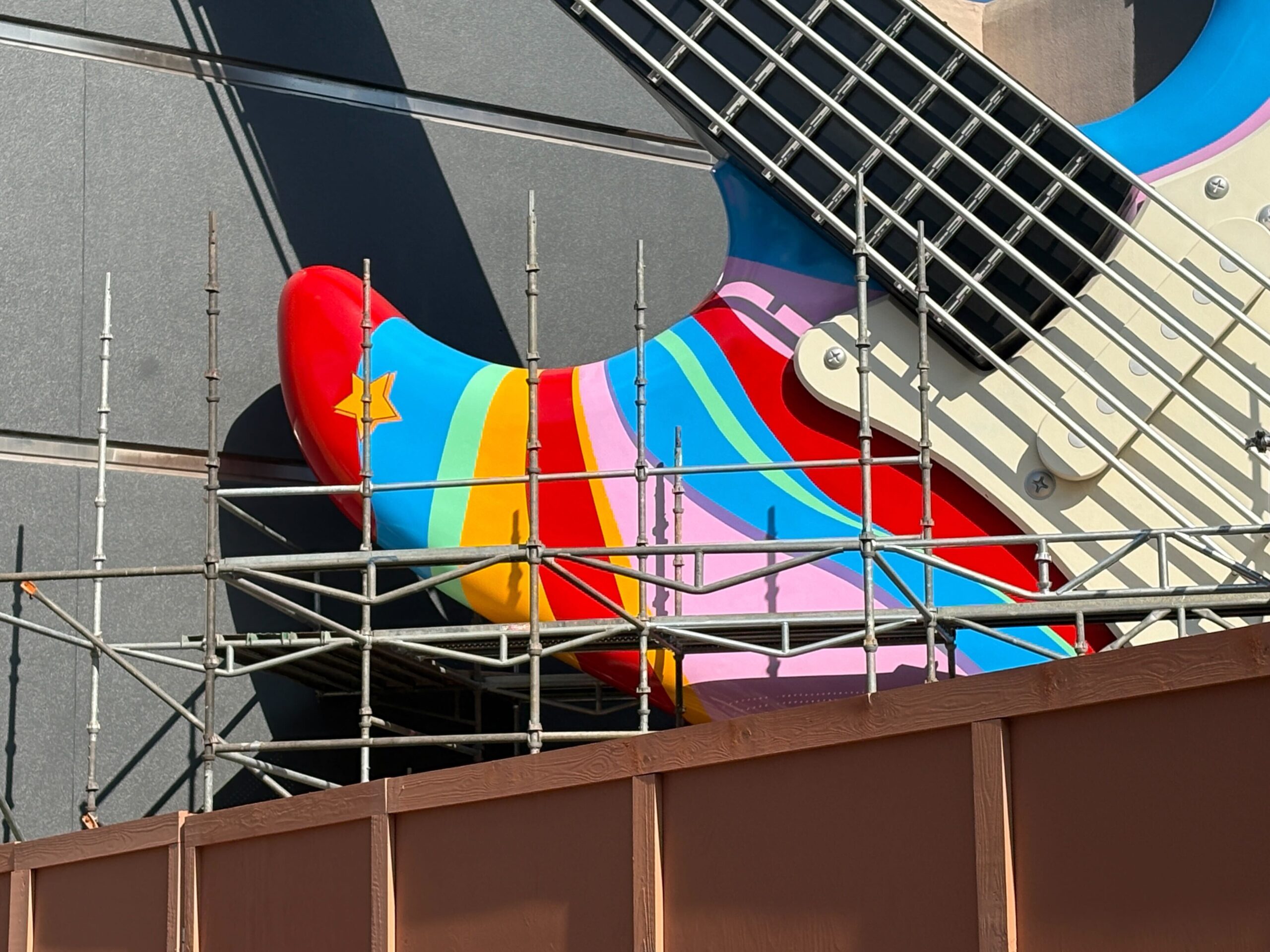 The top left side of the guitar appears to be the most complete so far, with jagged stripes and a star.