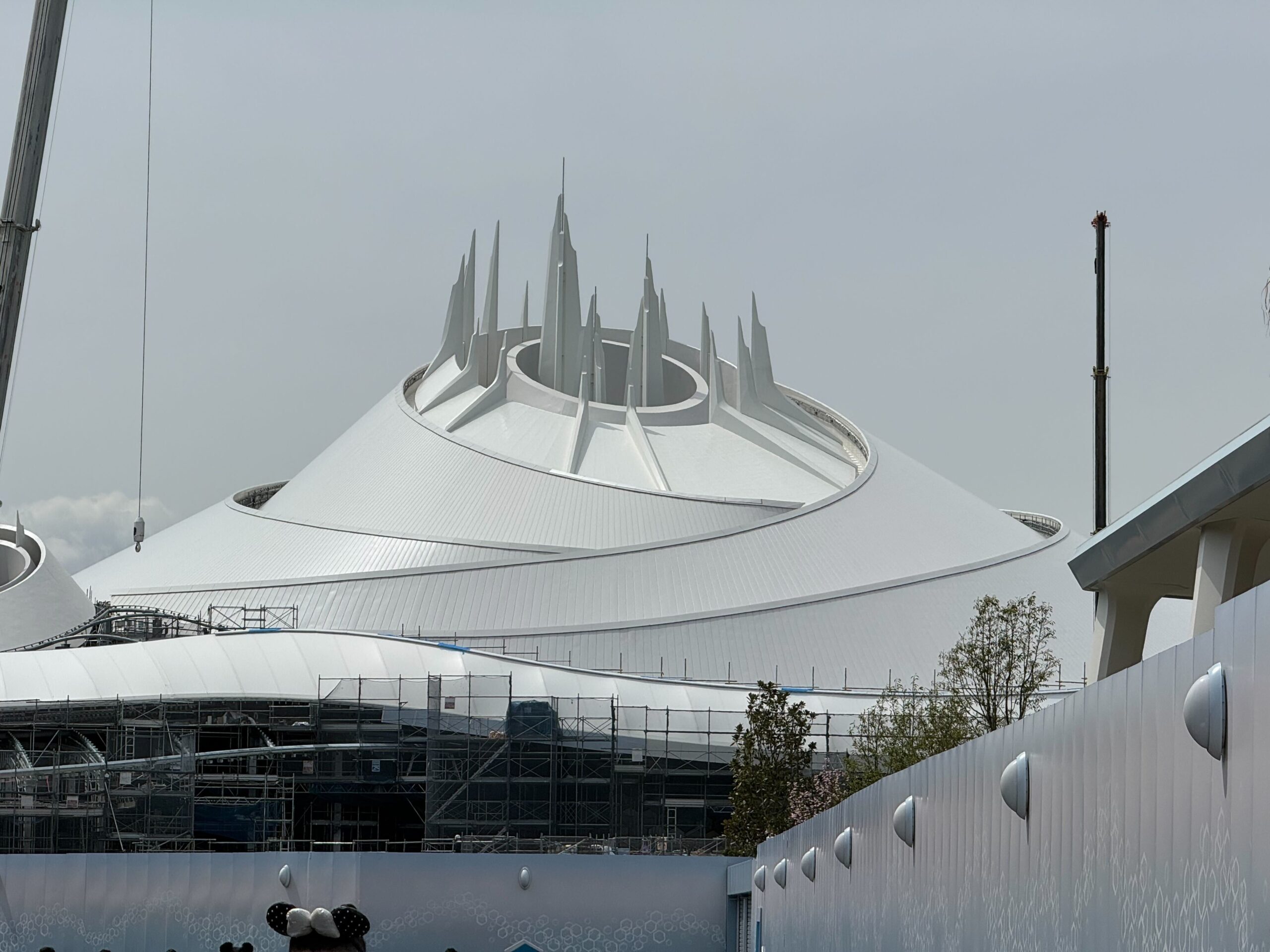 Scaffolding has come down around the brand-new Space Mountain at Tokyo Disney Resort, which is under construction and set to open in 2027.