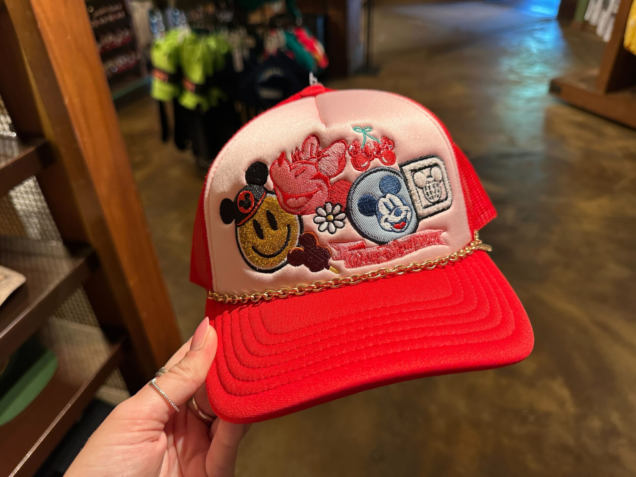 Front of Disney World Icons Red Trucker Hat.