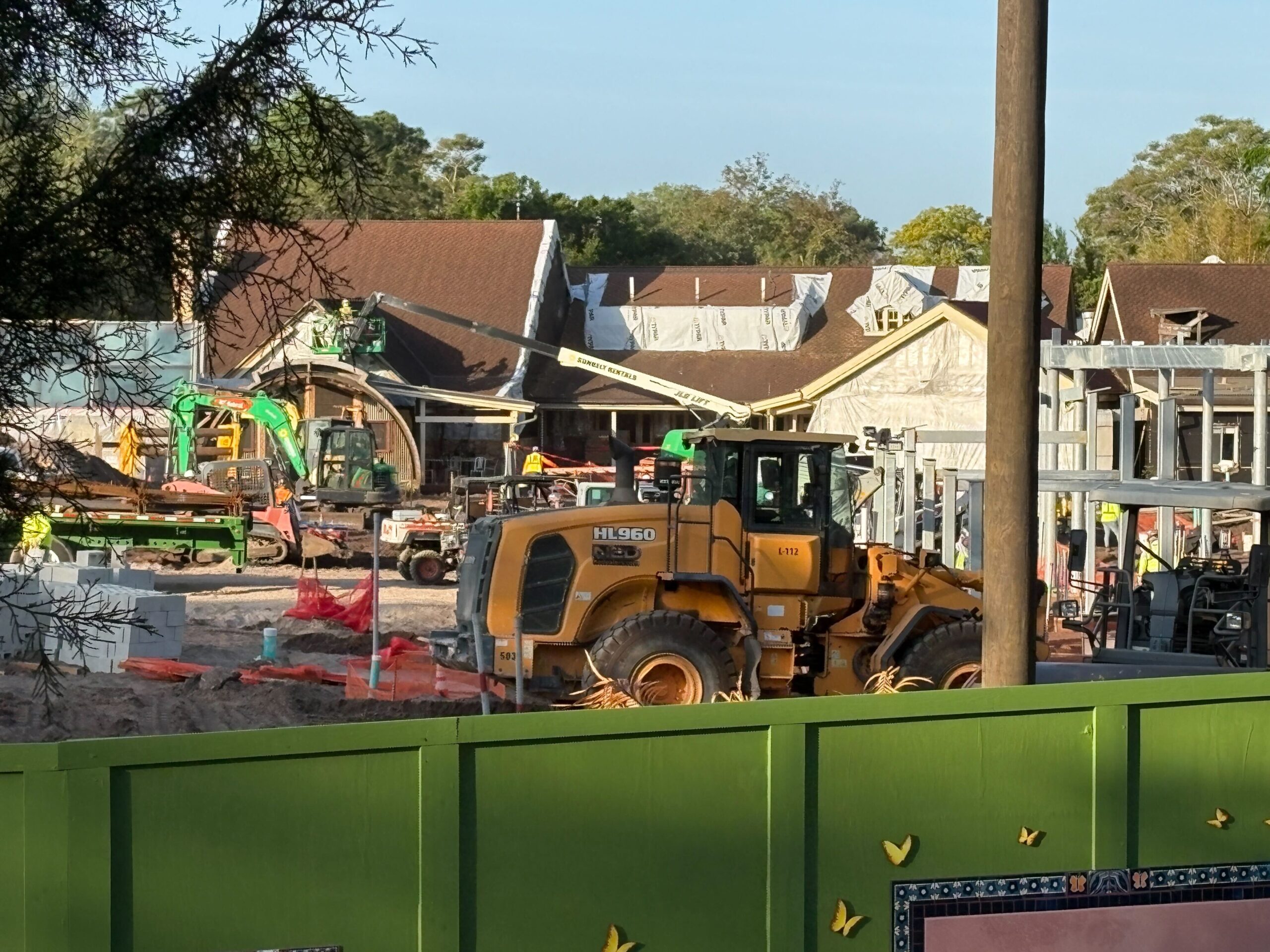 Crews Removing Restaurantosaurus Roofing for Tropical Americas Transformation