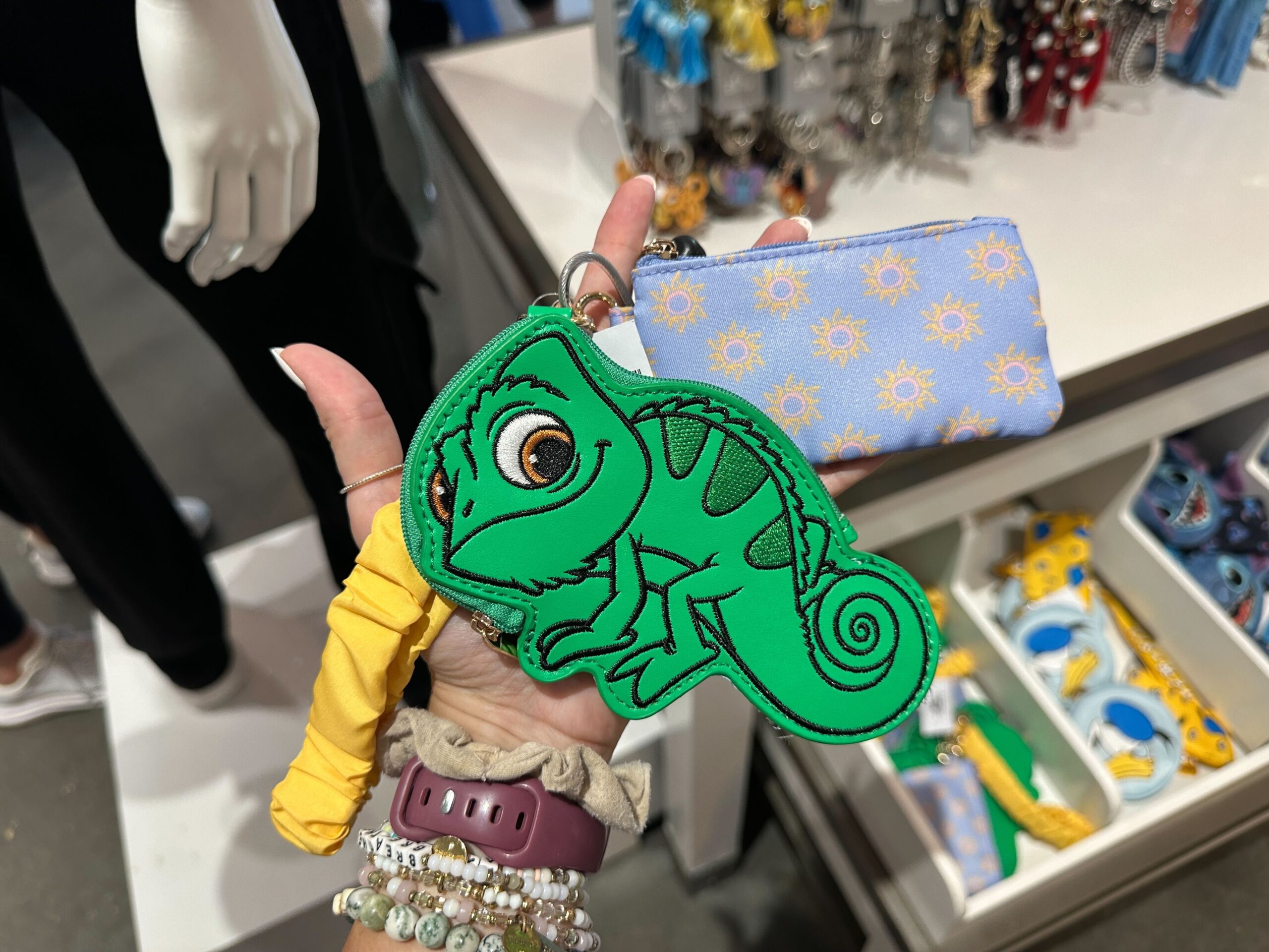 ‘Tangled’ Wristlet at Disney World Features Pascal, Corona Suns, & Multiple Pouches