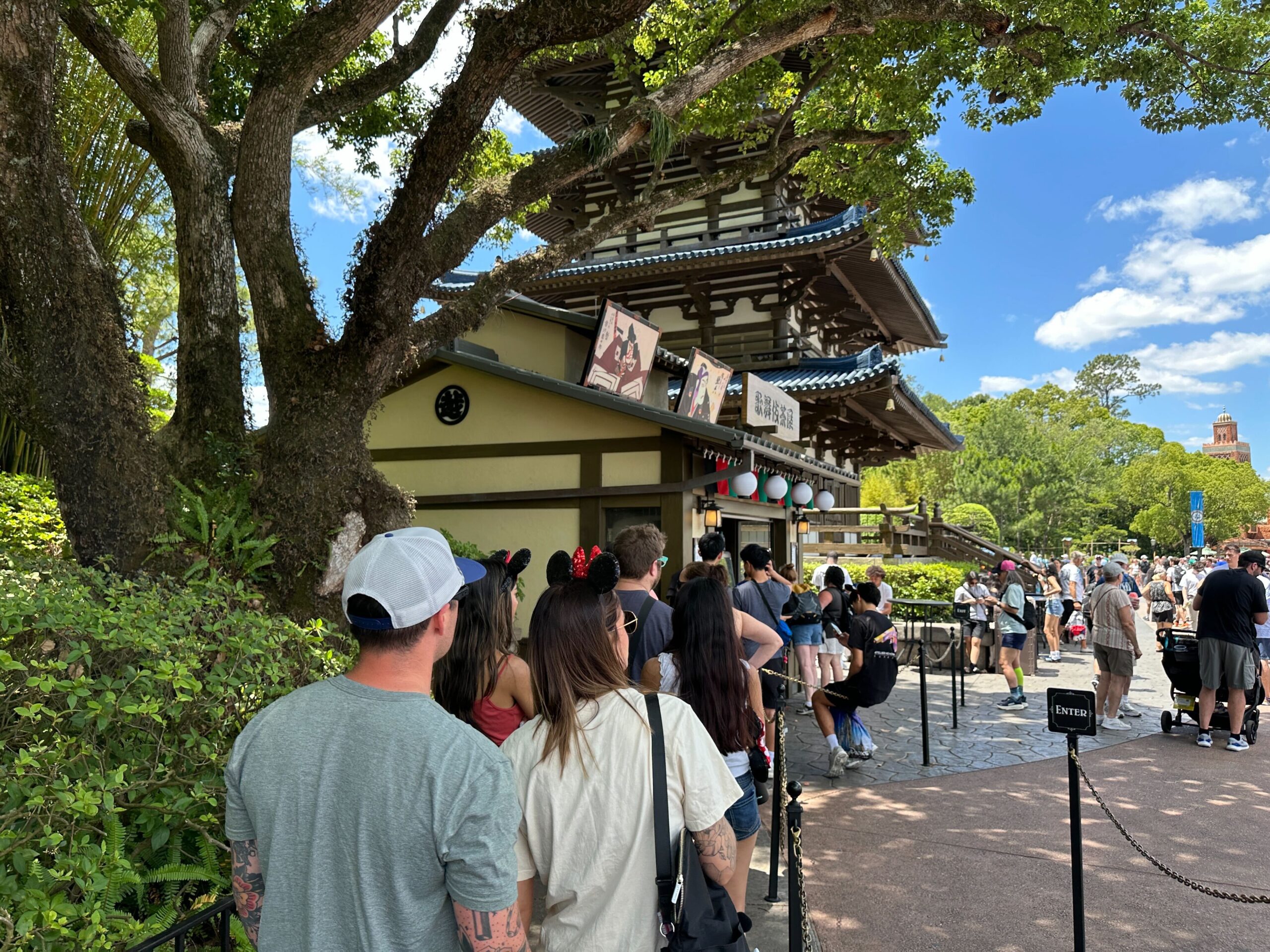 Long line of people outside of Kabuki Cafe in the Japan Pavilion at EPCOT.