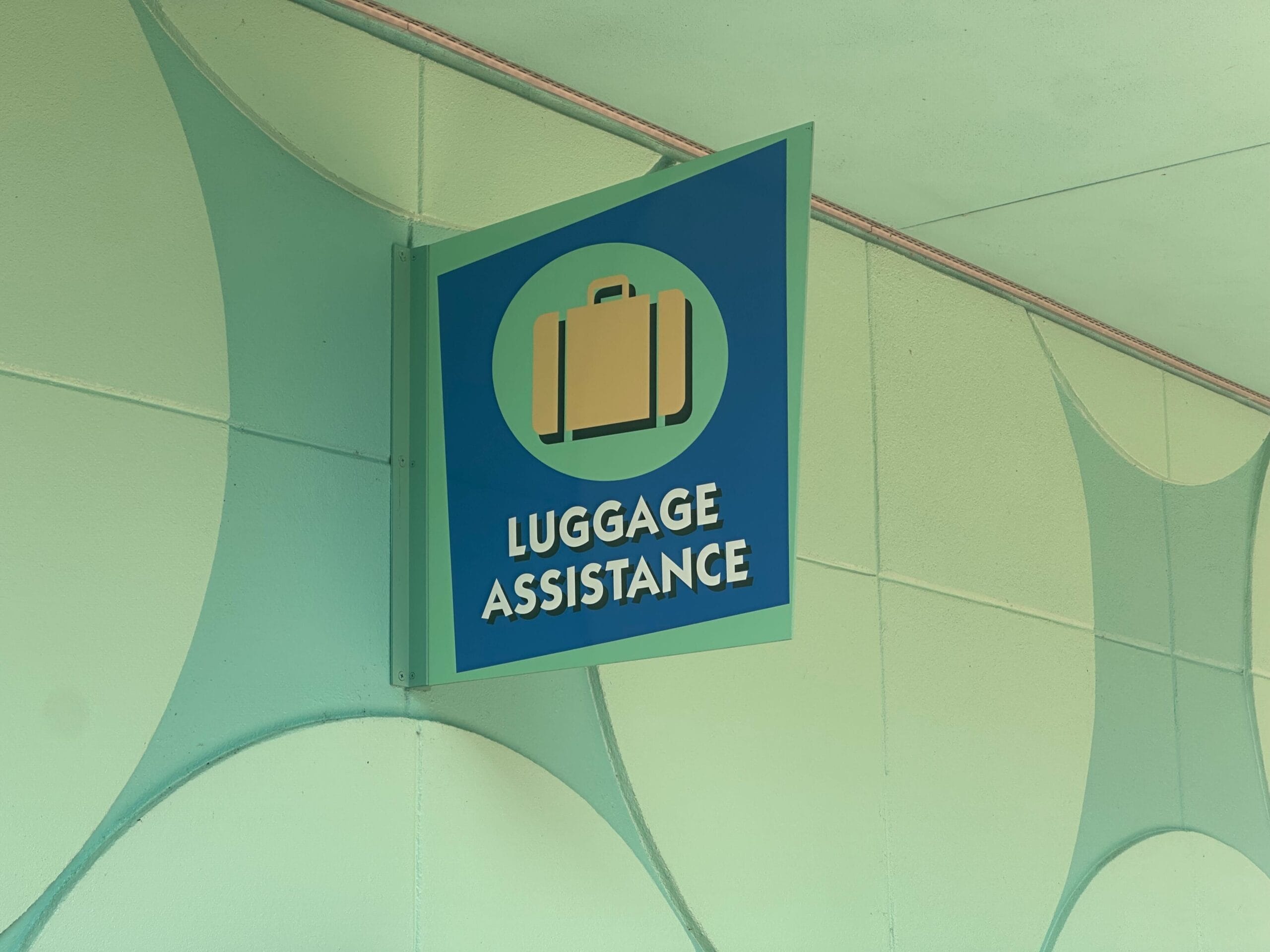 Luggage Assistance sign at a hotel.