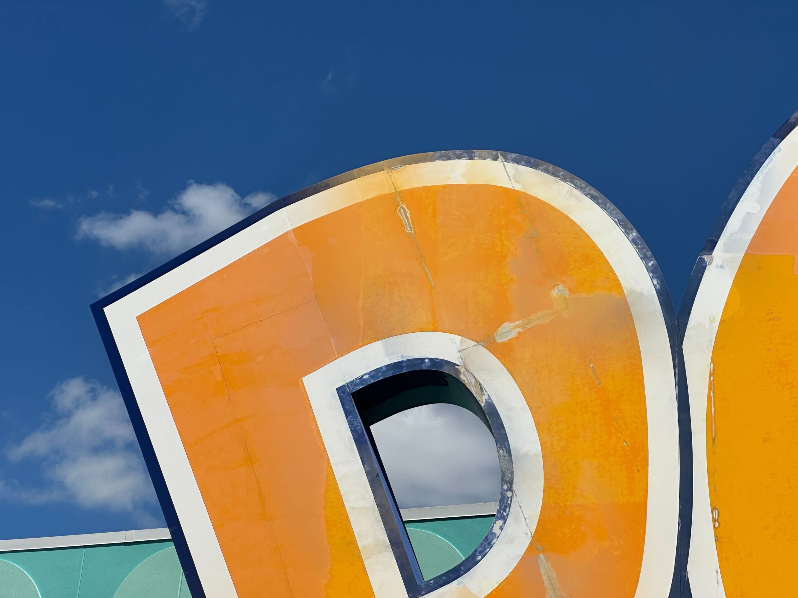 Crews have started a refurbishment of the giant "POP" sign outside Classic Hall at Disney's Pop Century Resort.
