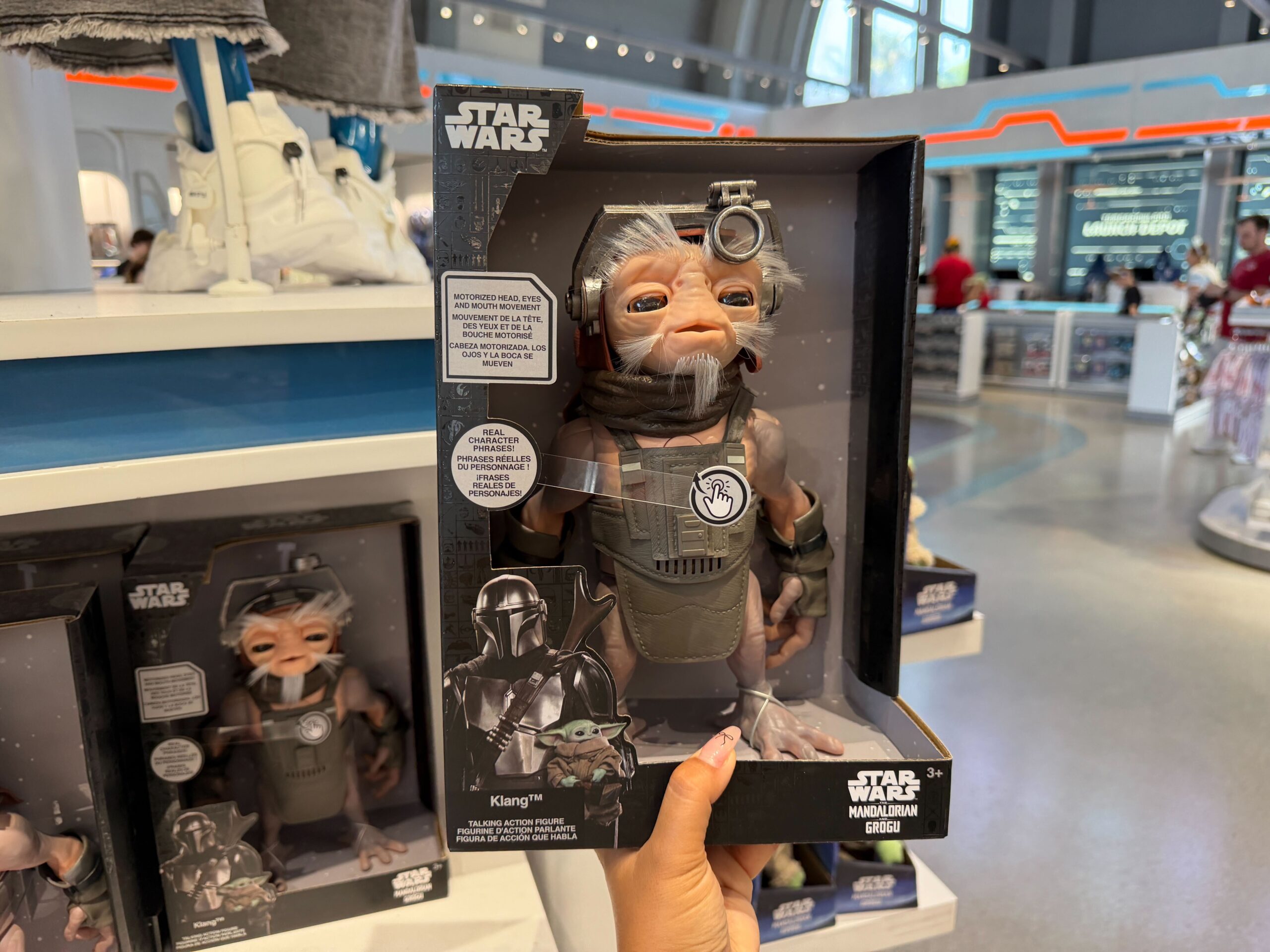 A larger Klang figure stands on his own. He has motorized head, eyes, and mouth movement. When you press his chest, he'll speak. There are six points of articulation.