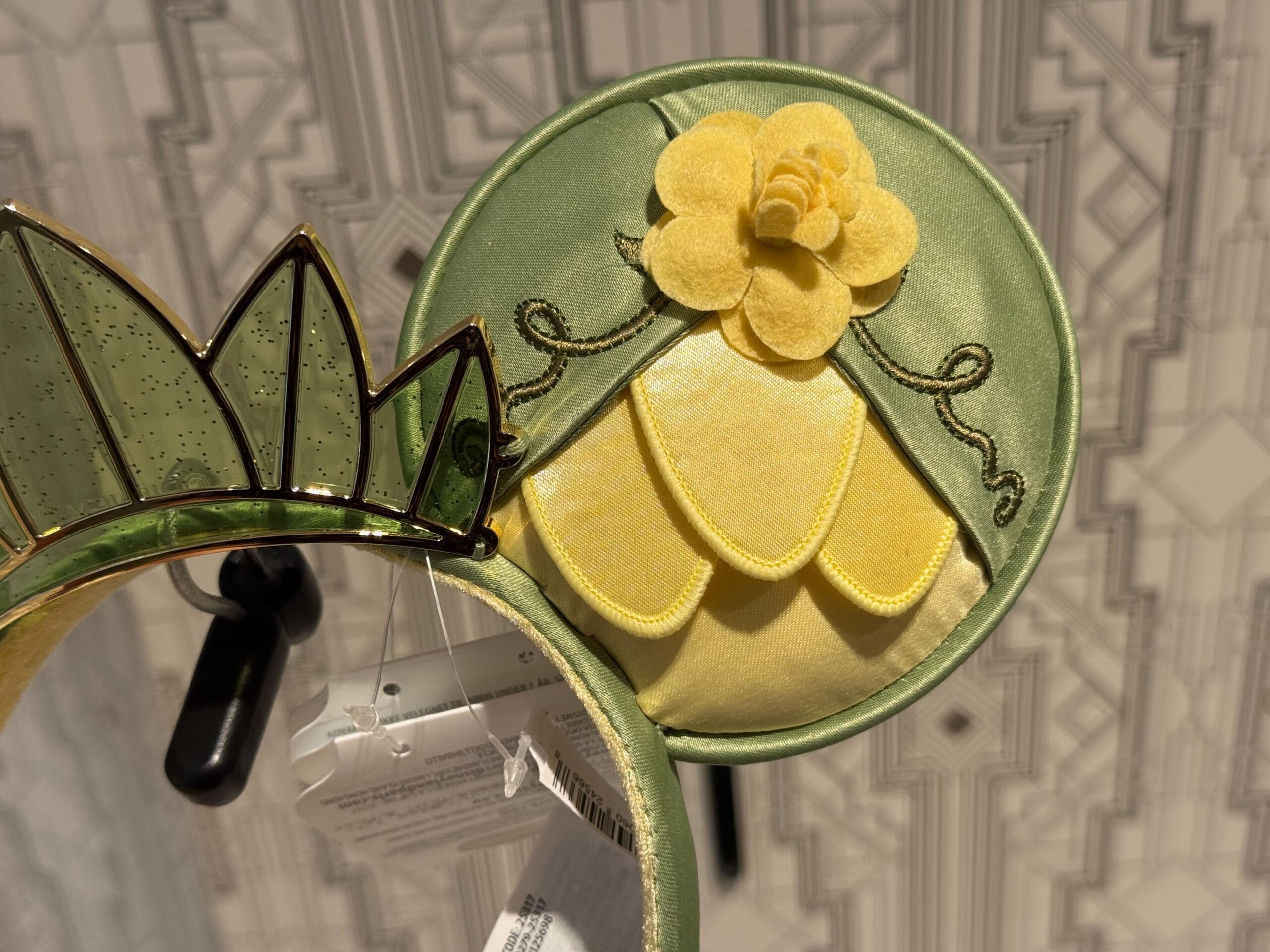 A new ear headband inspired by Princess Tiana's lily Pad dress from The Princess and the Frog has arrived at Walt Disney World.