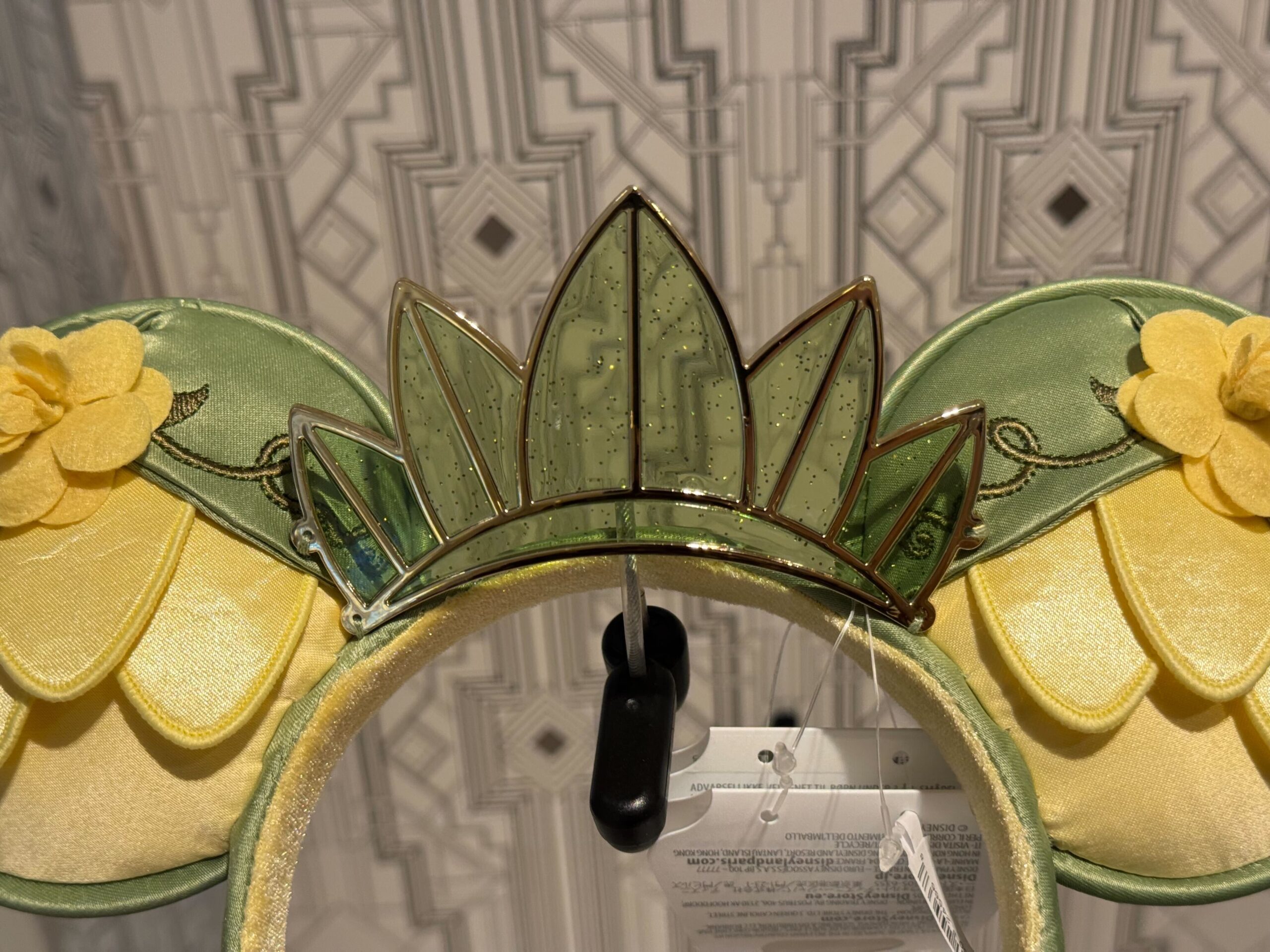A new ear headband inspired by Princess Tiana's lily Pad dress from The Princess and the Frog has arrived at Walt Disney World.