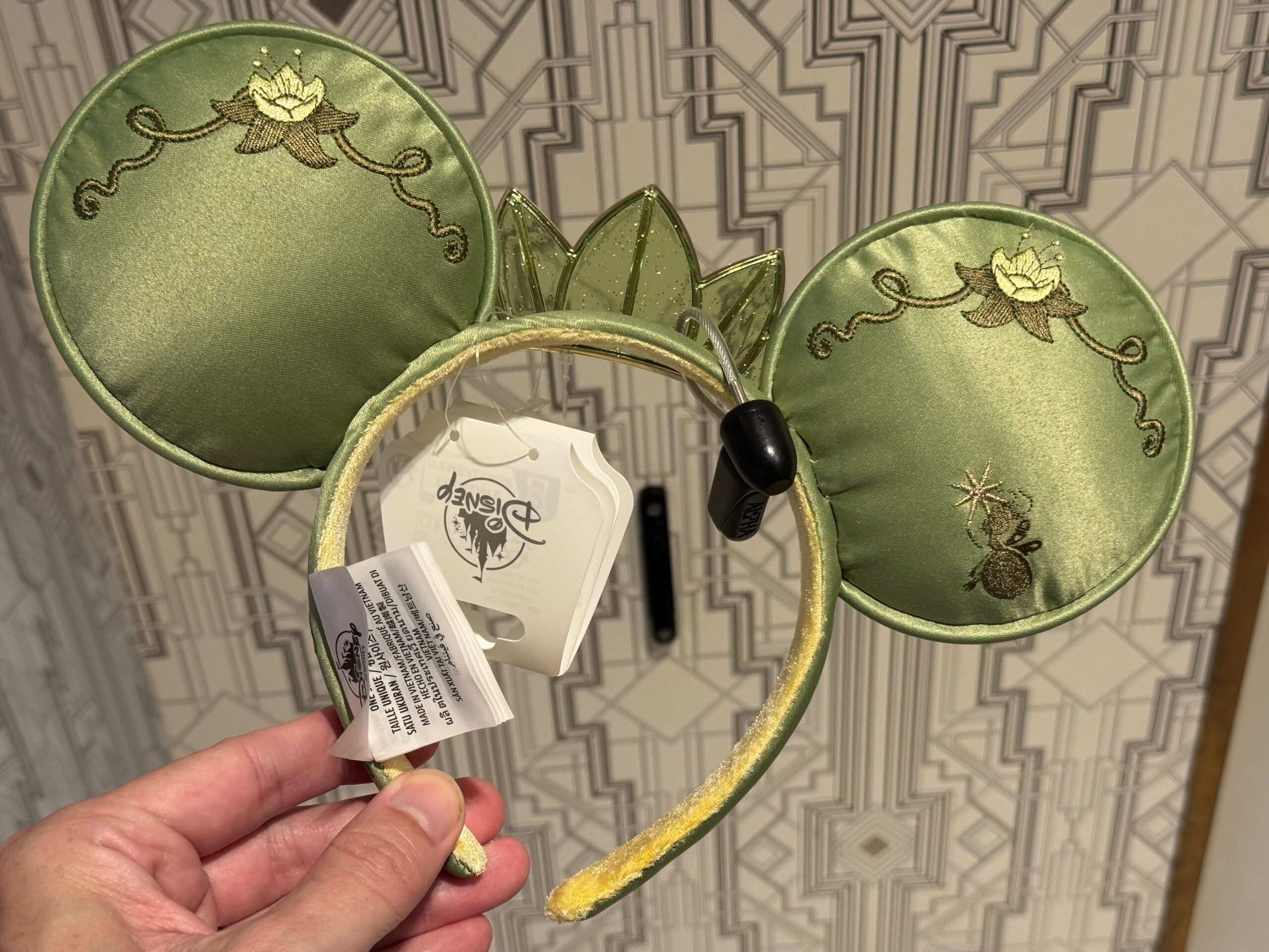 A new ear headband inspired by Princess Tiana's lily Pad dress from The Princess and the Frog has arrived at Walt Disney World.