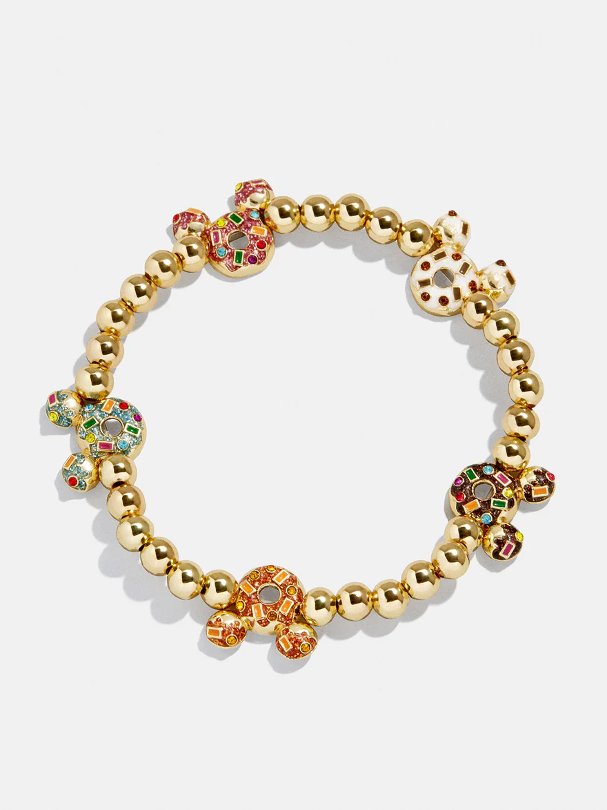 This primarily gold stretch bracelet has round, gold beads in between each Mickey icon bead. Each icon is in the shape of a multicolored donut. All the Mickey donuts have a different colored frosting and sprinkle combination.