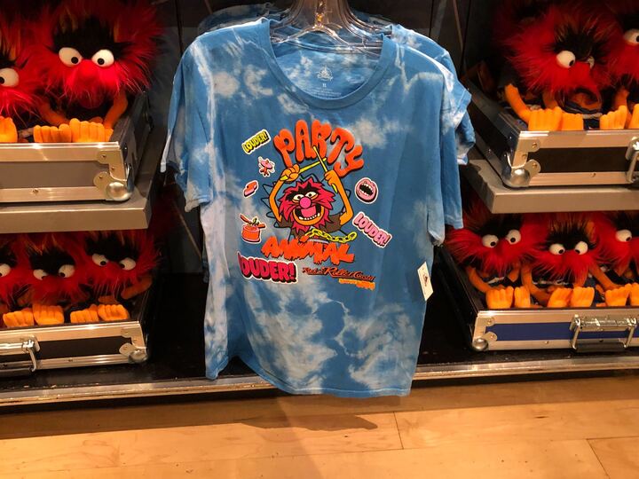 Another Party Animal shirt is blue and white tie-dyed with Animal holding his drumsticks and, again, surrounded by LOUDER! text and iconography.