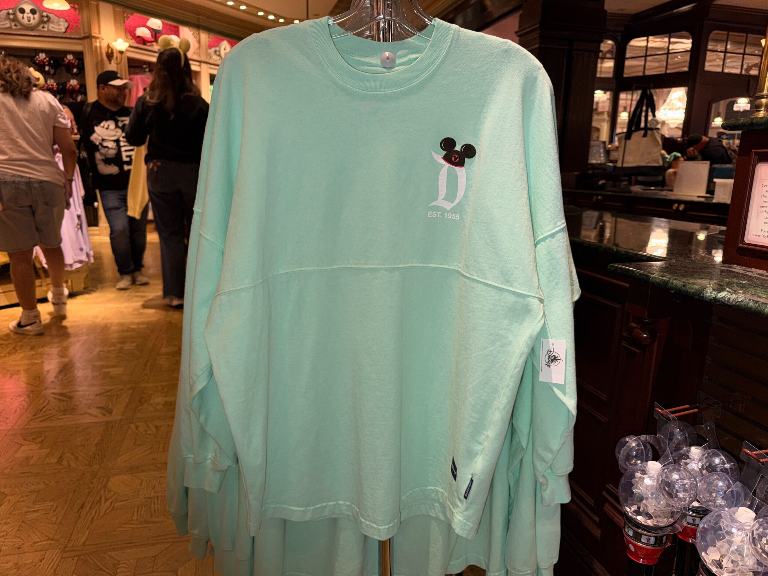 A new pair of Disneyland Spirit Jerseys has arrived at the resort, giving families a matching apparel option with a colorful park icon design.