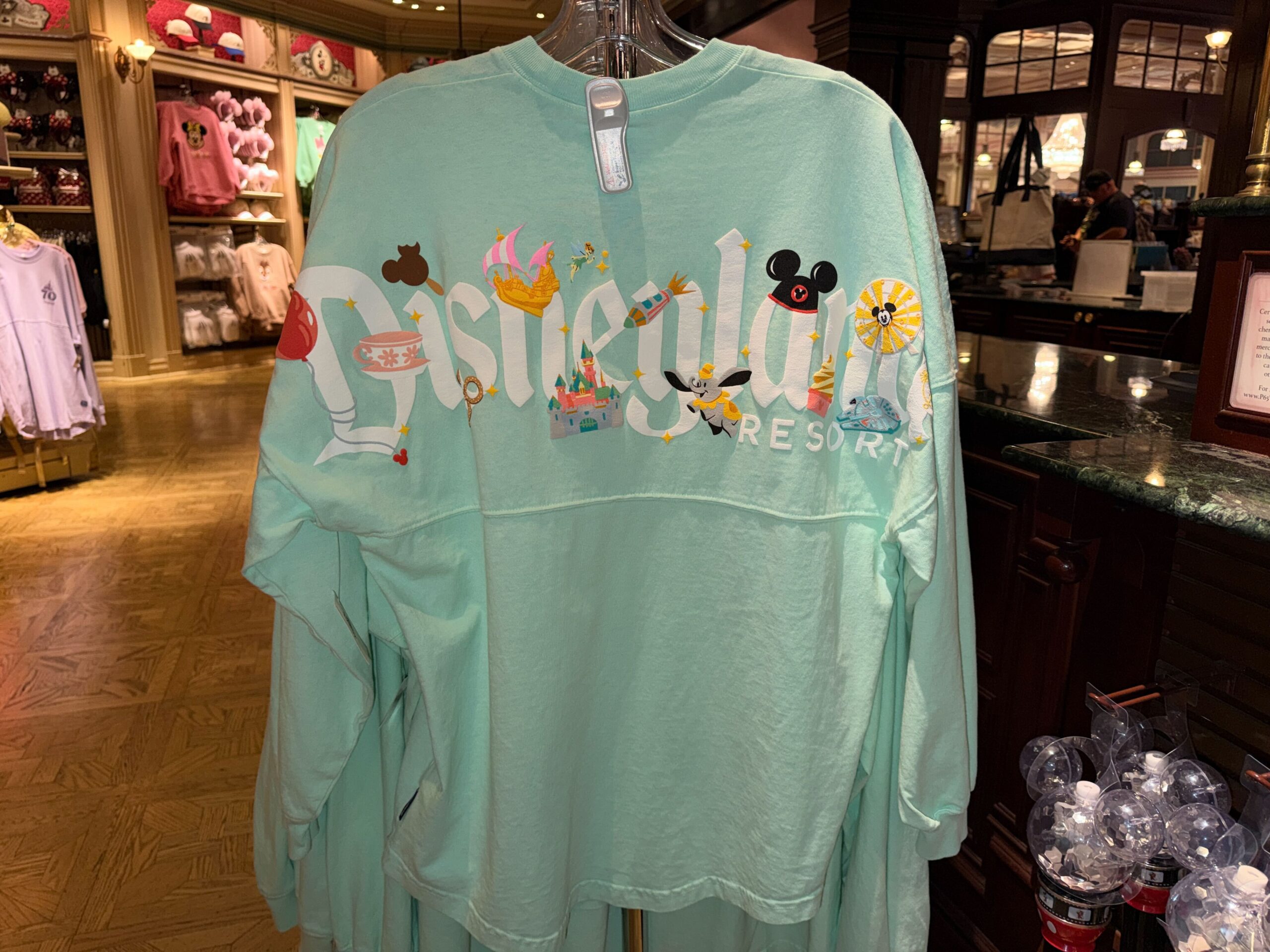 A new pair of Disneyland Spirit Jerseys has arrived at the resort, giving families a matching apparel option with a colorful park icon design.