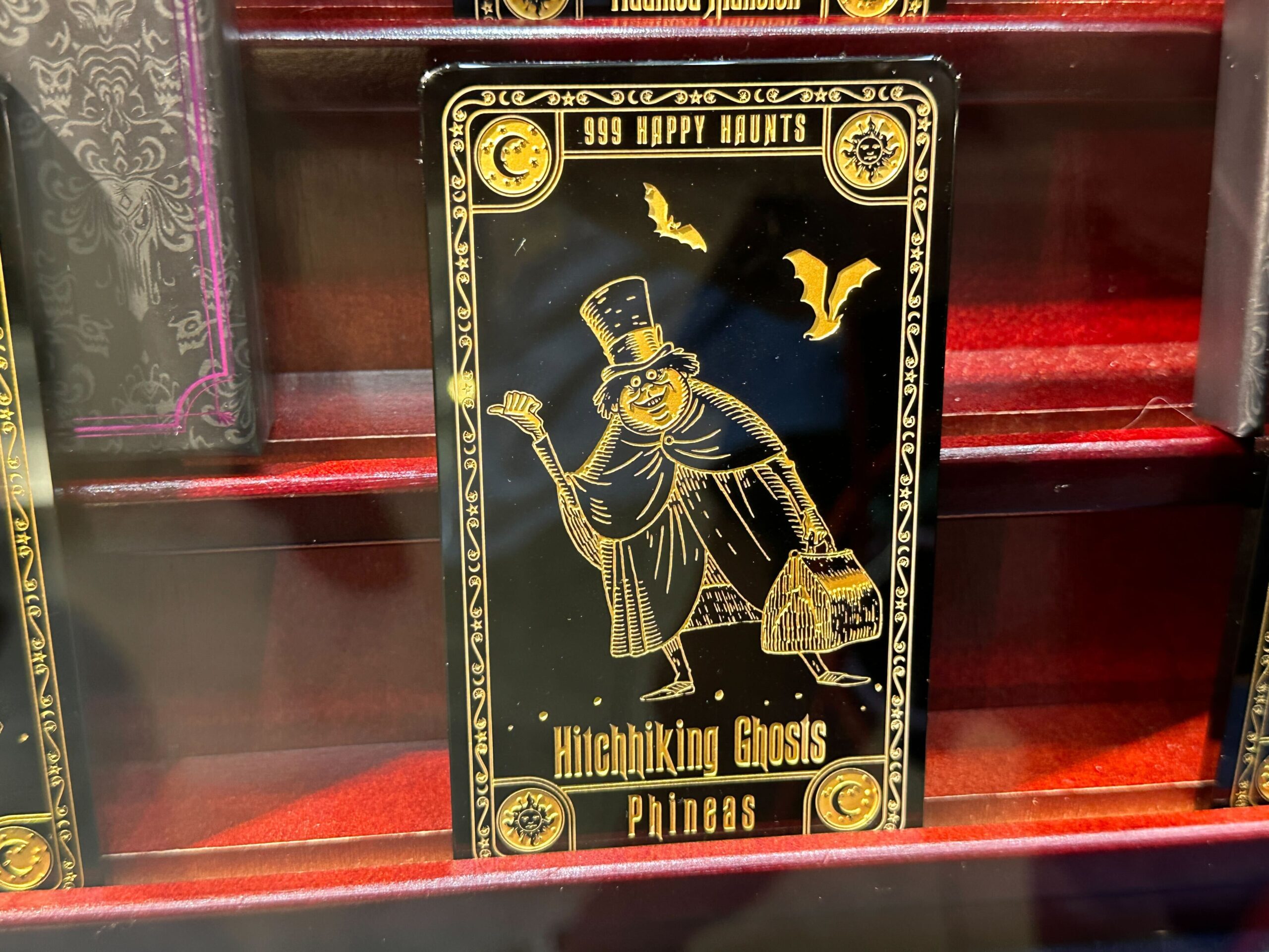 Haunted Mansion collector card sets featuring Phineas the Hitchhiking Ghost are now available at Walt Disney World.