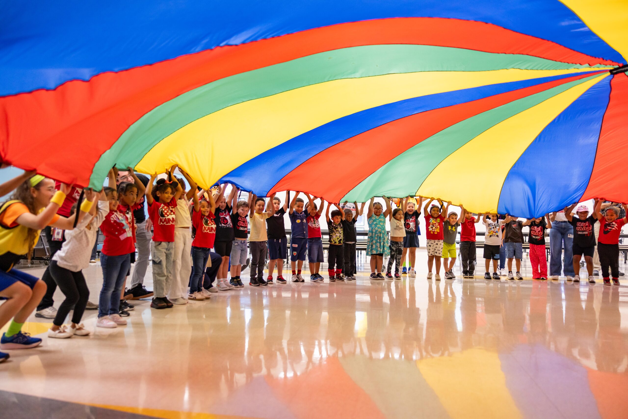 Walt Disney World brought Cool Kids' Summer directly to five Central Florida school districts, playing GoofyCore games with students, surprising teachers with theme park tickets, and announcing a $1.3 million investment in education programs.