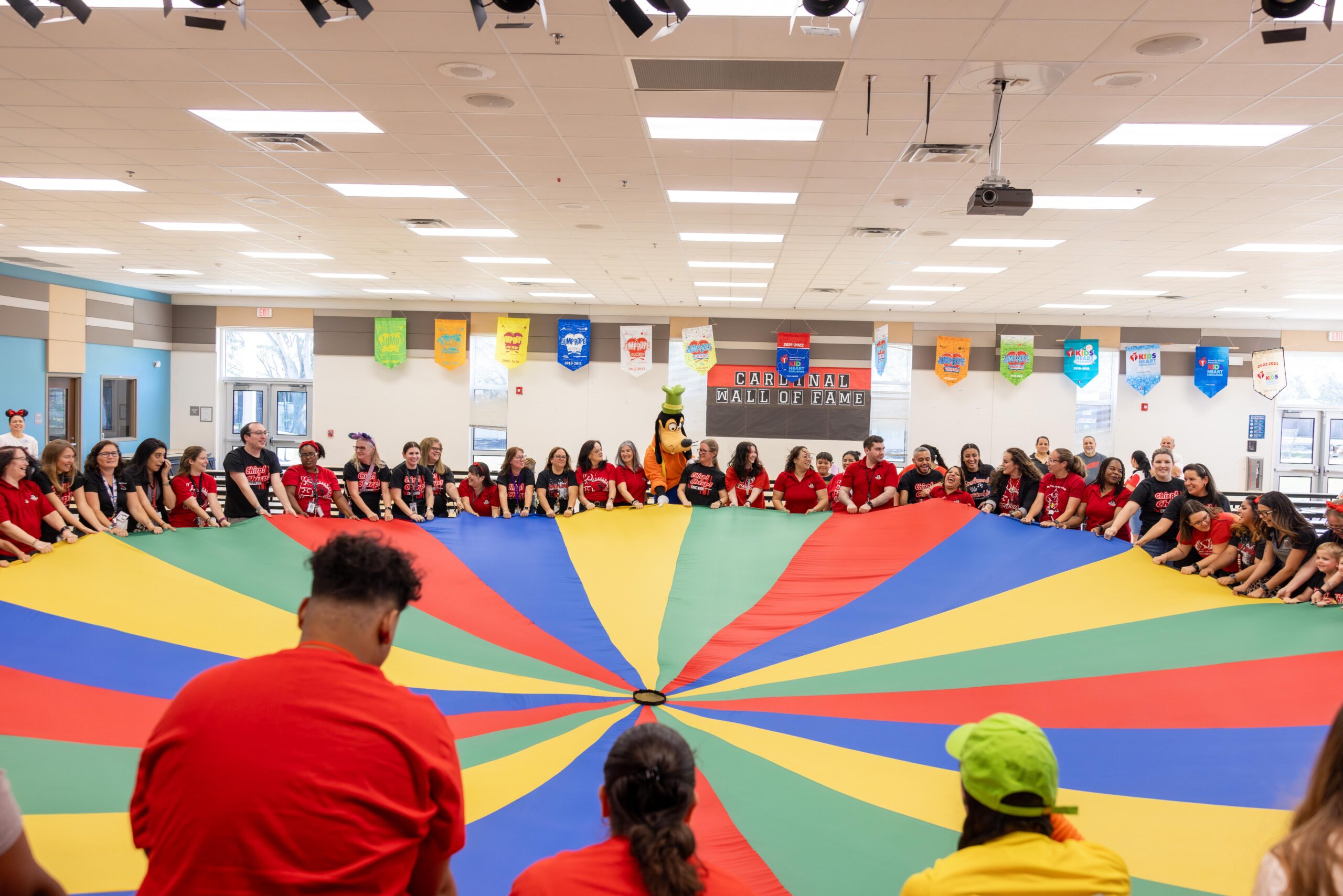 Walt Disney World brought Cool Kids' Summer directly to five Central Florida school districts, playing GoofyCore games with students, surprising teachers with theme park tickets, and announcing a $1.3 million investment in education programs.