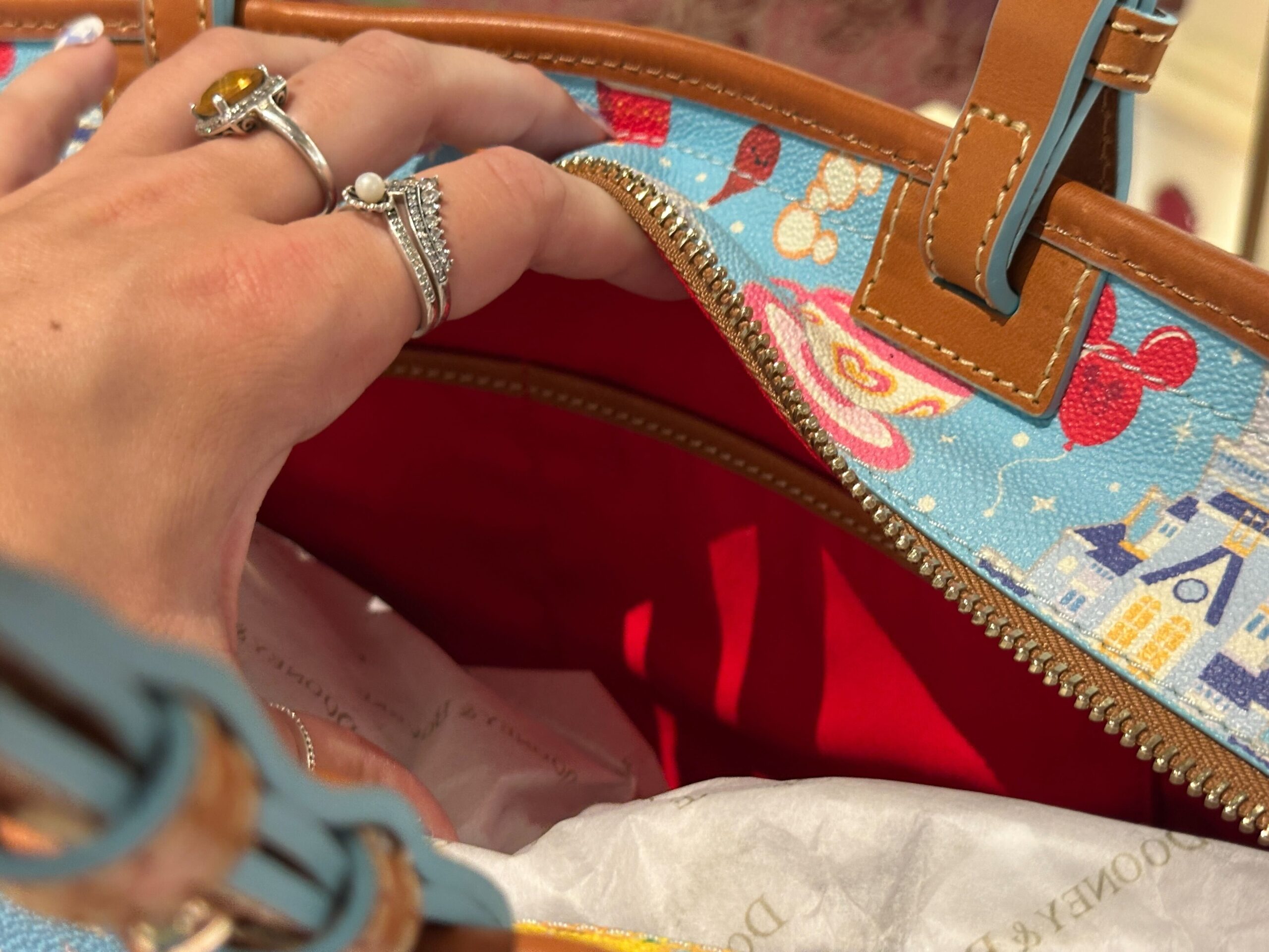 Dooney & Bourke Bag Features Mickey Balloons, Figment, Orange Bird