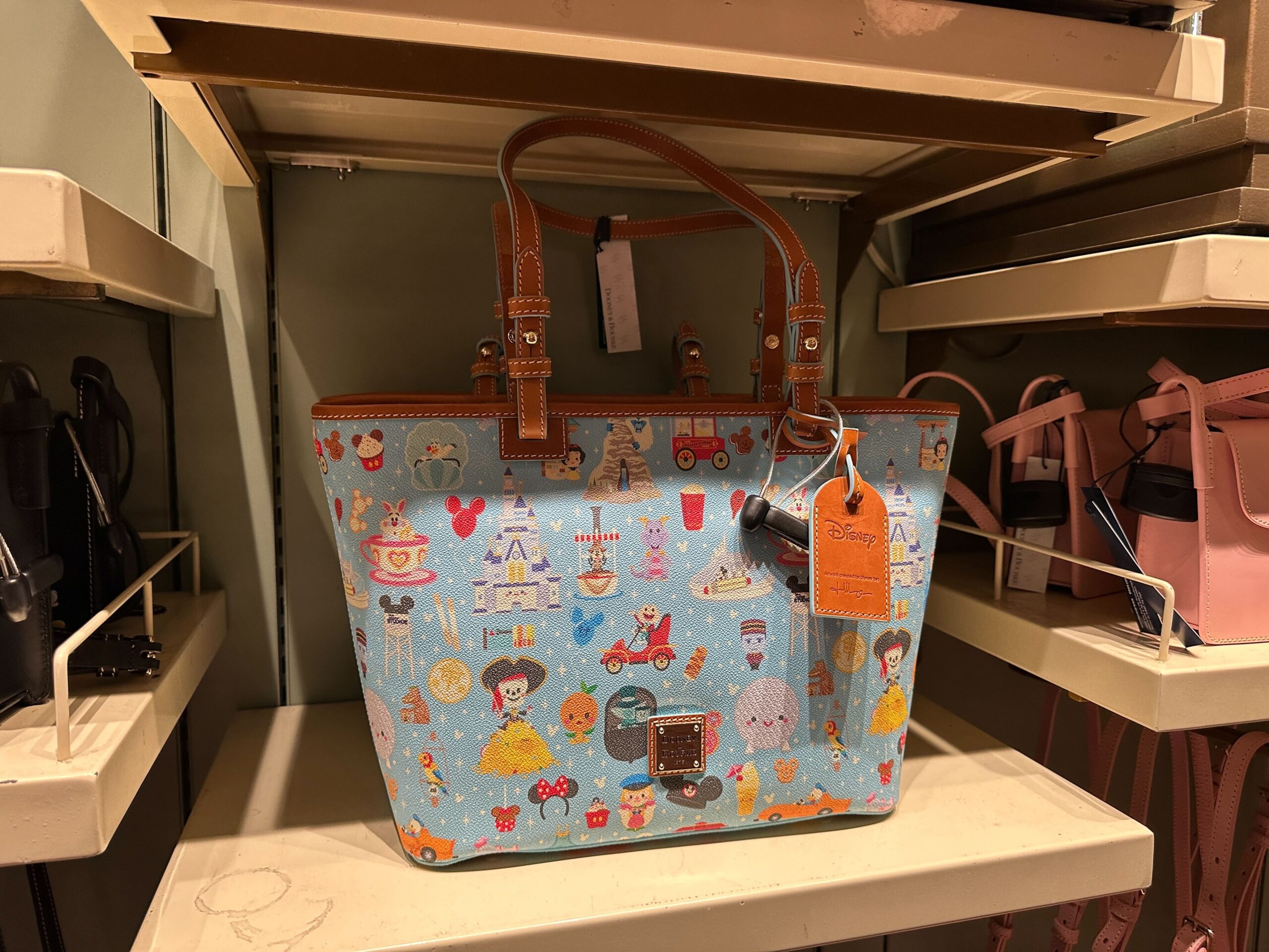 Dooney & Bourke Bag Features Mickey Balloons, Figment, Orange Bird