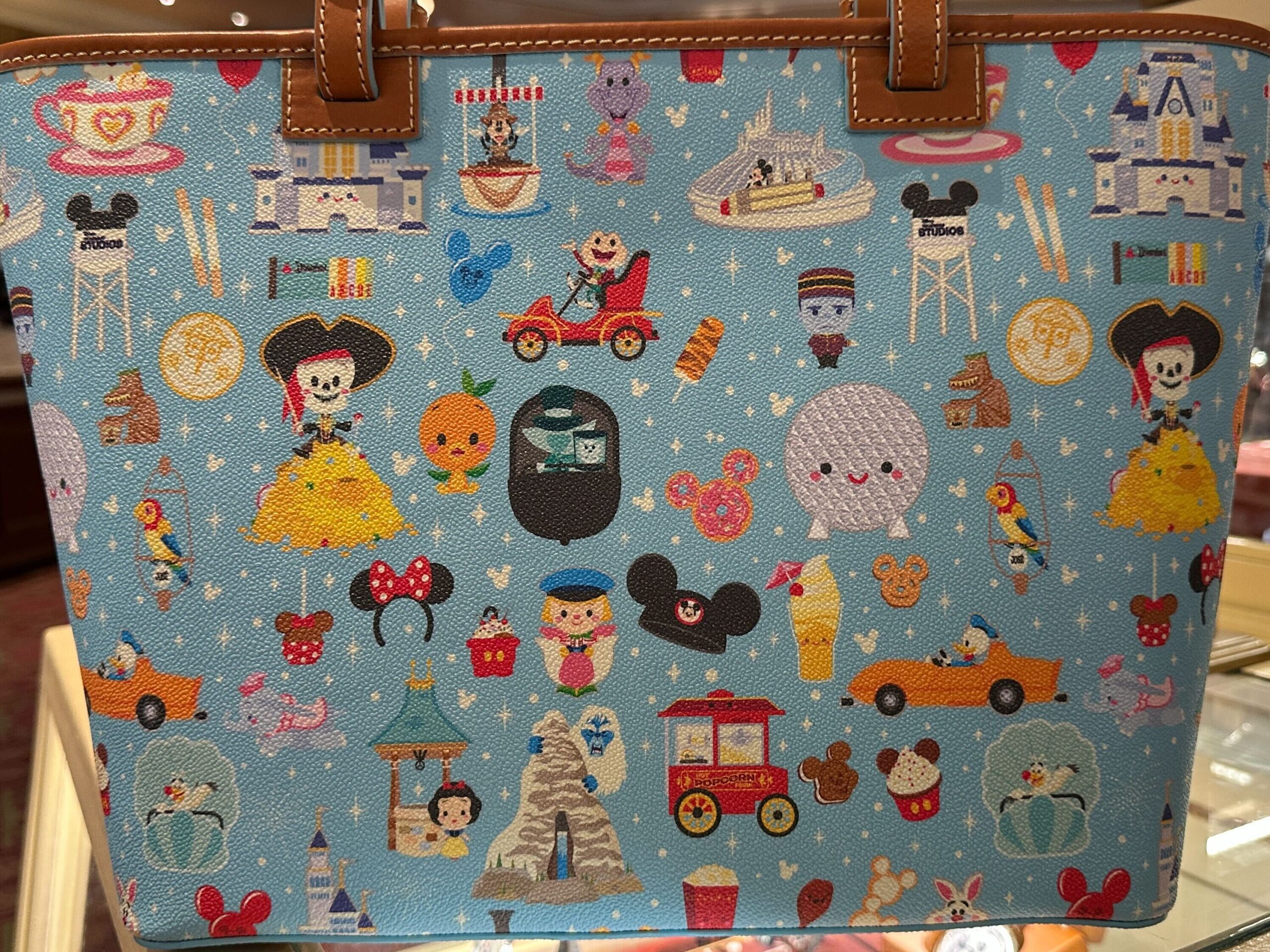 A new Dooney & Bourke bag has arrived with a tiny all-over Disney Parks print that demands a closer look.