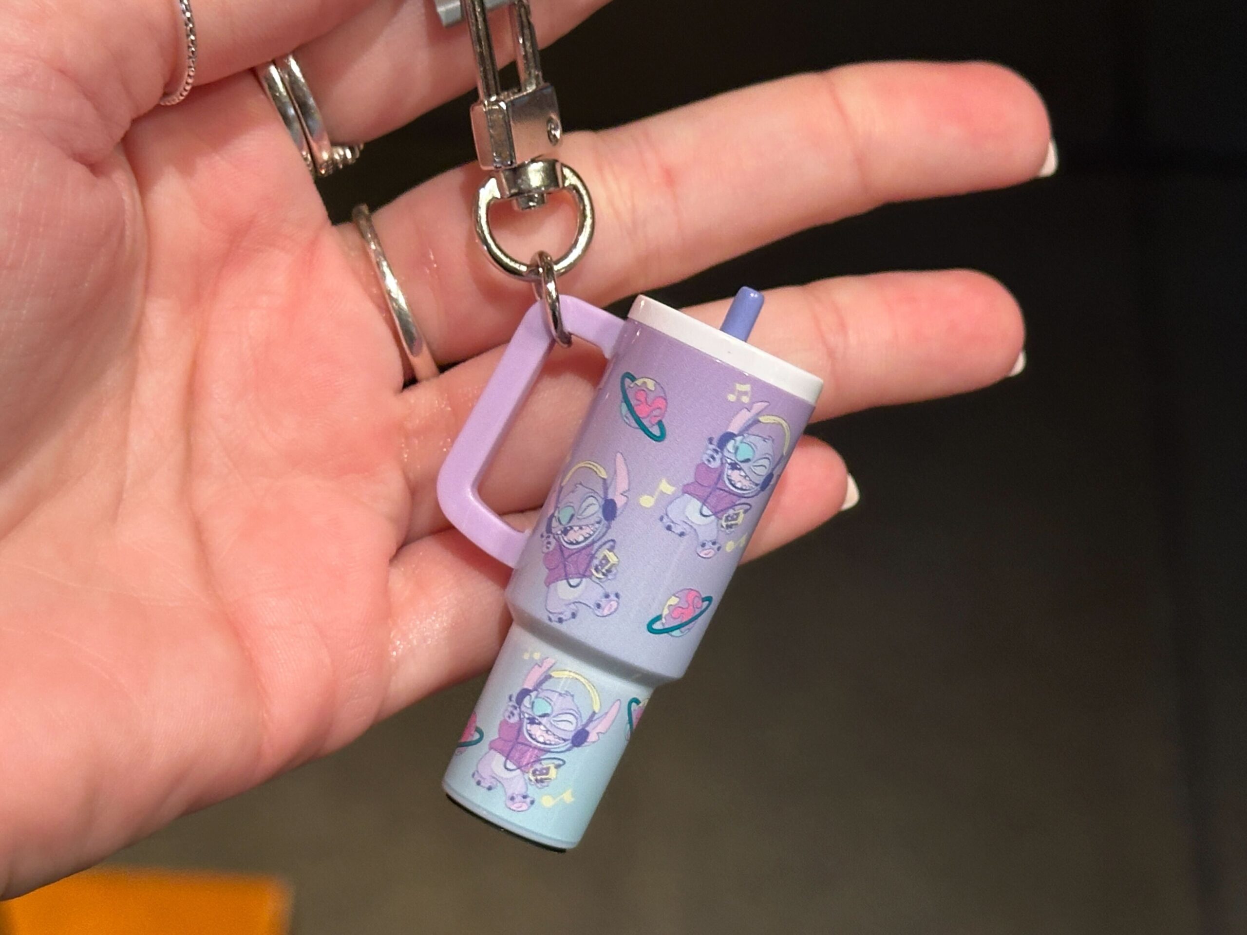 The small charms are designed to resemble the explosively popular 40oz tumblers from recent years. They hang from silver-tone key rings and lobster clasps, making them easy to attach to a bag, backpack, lanyard, or set of keys.