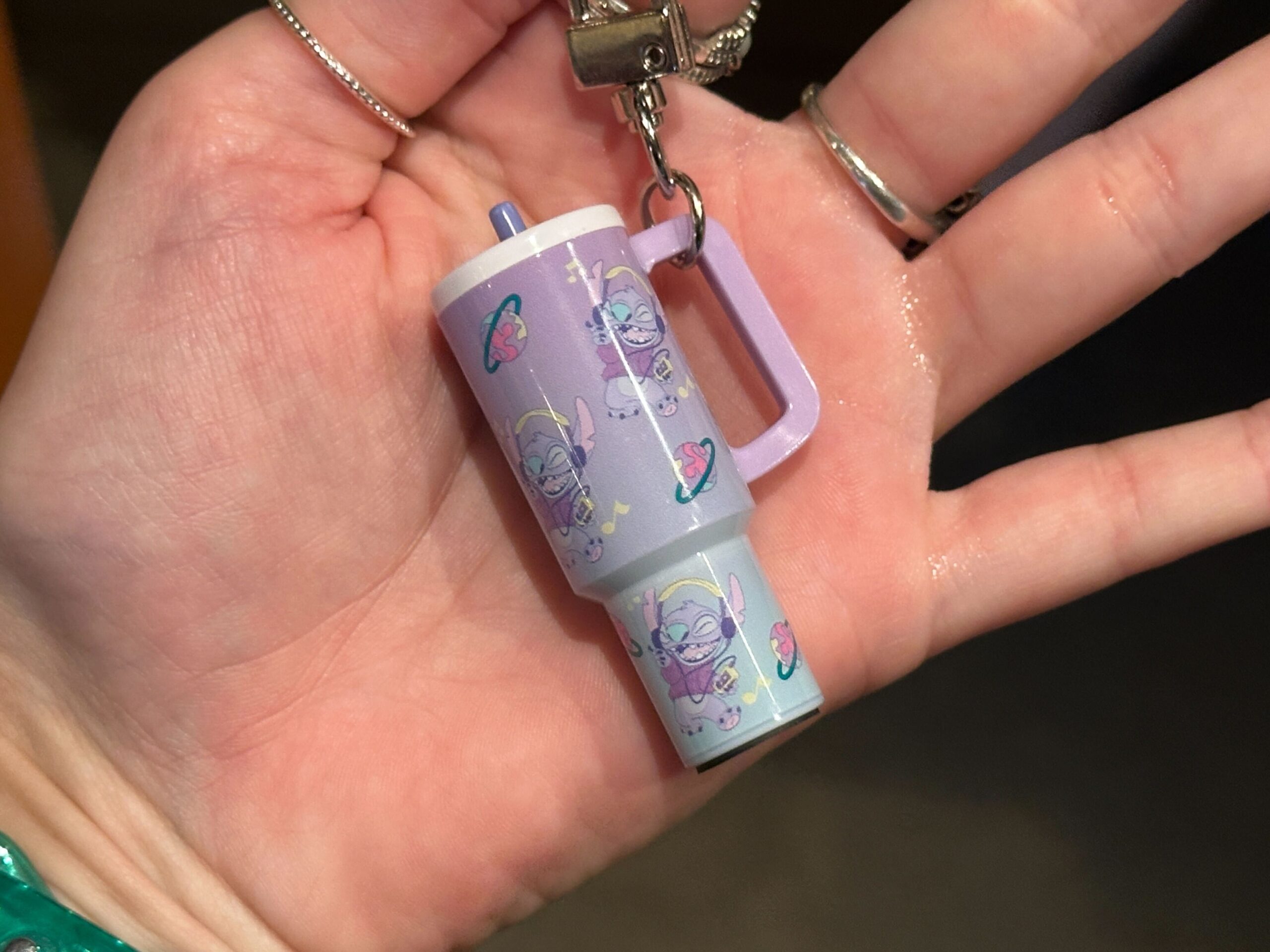 The small charms are designed to resemble the explosively popular 40oz tumblers from recent years. They hang from silver-tone key rings and lobster clasps, making them easy to attach to a bag, backpack, lanyard, or set of keys.