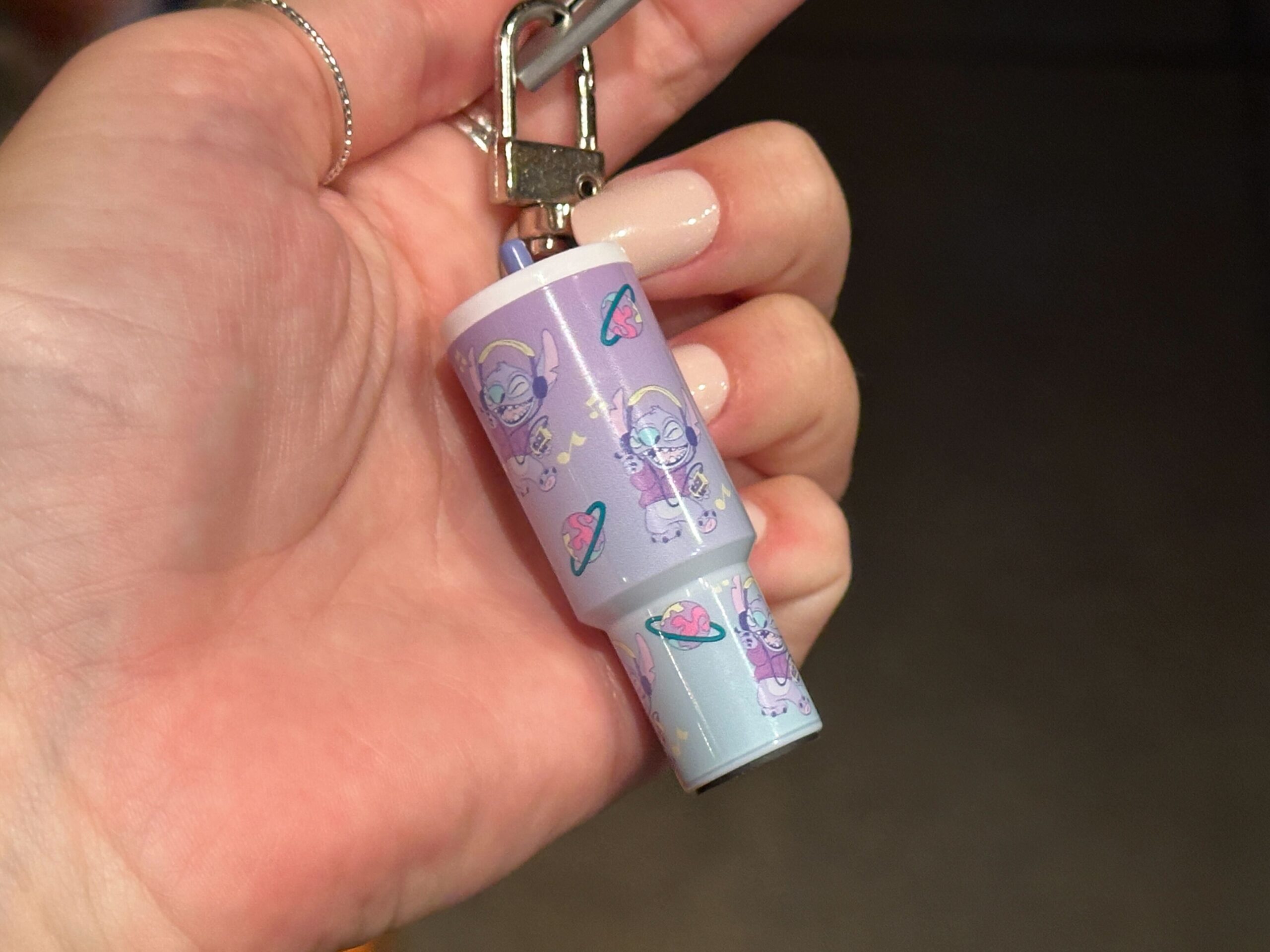 The small charms are designed to resemble the explosively popular 40oz tumblers from recent years. They hang from silver-tone key rings and lobster clasps, making them easy to attach to a bag, backpack, lanyard, or set of keys.