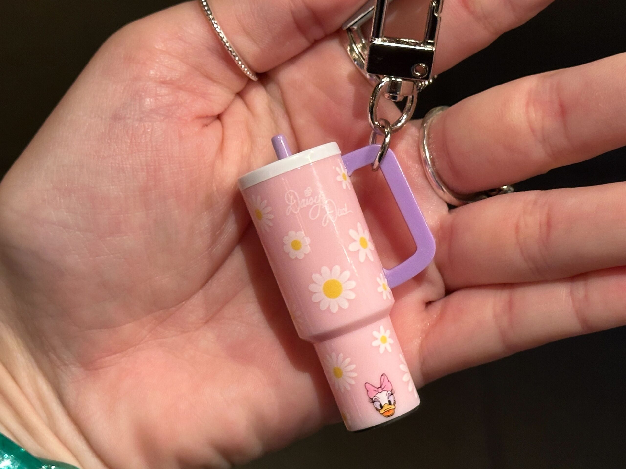 The small charms are designed to resemble the explosively popular 40oz tumblers from recent years. They hang from silver-tone key rings and lobster clasps, making them easy to attach to a bag, backpack, lanyard, or set of keys.