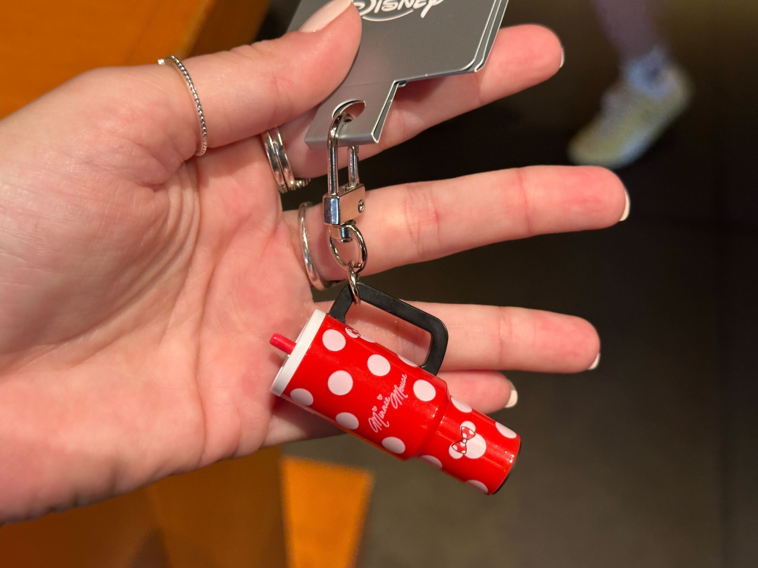 The small charms are designed to resemble the explosively popular 40oz tumblers from recent years. They hang from silver-tone key rings and lobster clasps, making them easy to attach to a bag, backpack, lanyard, or set of keys.