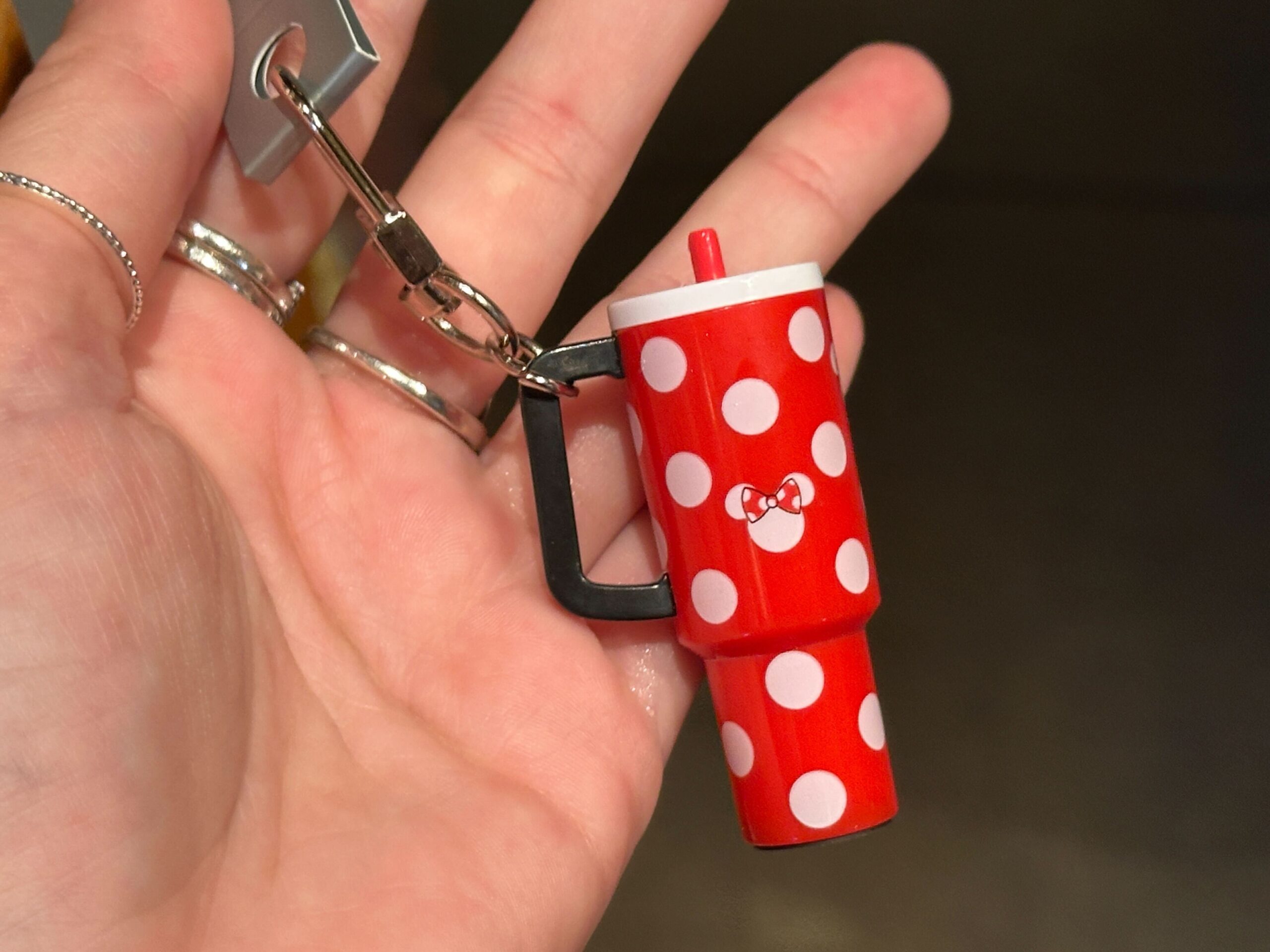 The small charms are designed to resemble the explosively popular 40oz tumblers from recent years. They hang from silver-tone key rings and lobster clasps, making them easy to attach to a bag, backpack, lanyard, or set of keys.