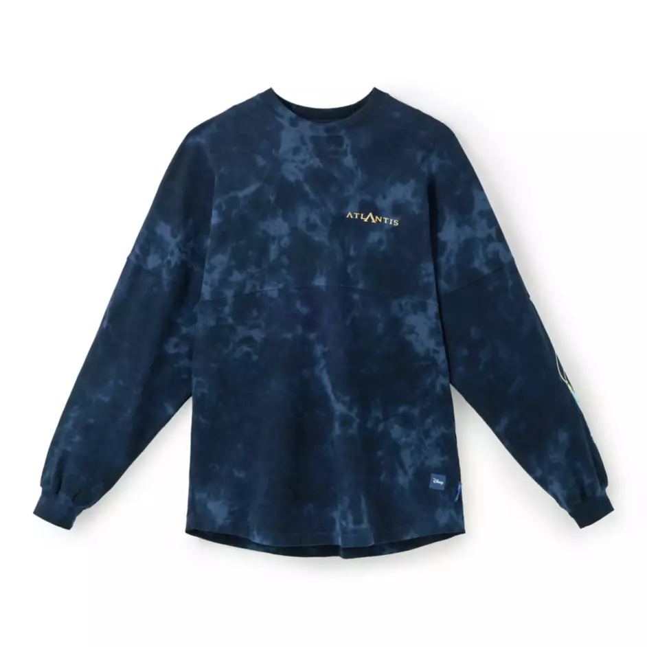 The Spirit Jersey is a dark blue mineral wash with puffy gold "Atlantis" on the chest. Atlantean symbols are on the sleeve.