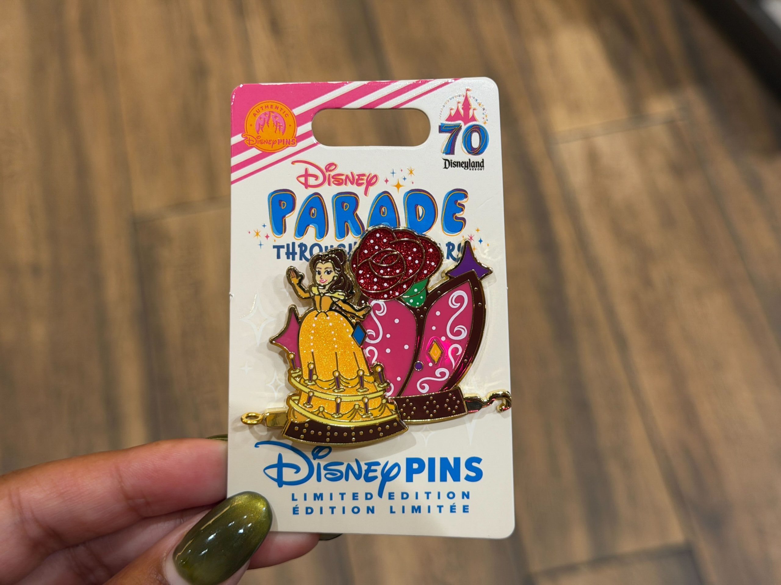 This month's Parade Through the Years pin features a float with Belle and the Enchanted Rose from Beauty and the Beast.
